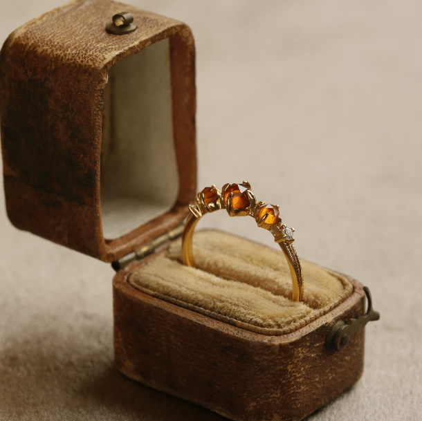 Gold Tone Ring with Orange Stones