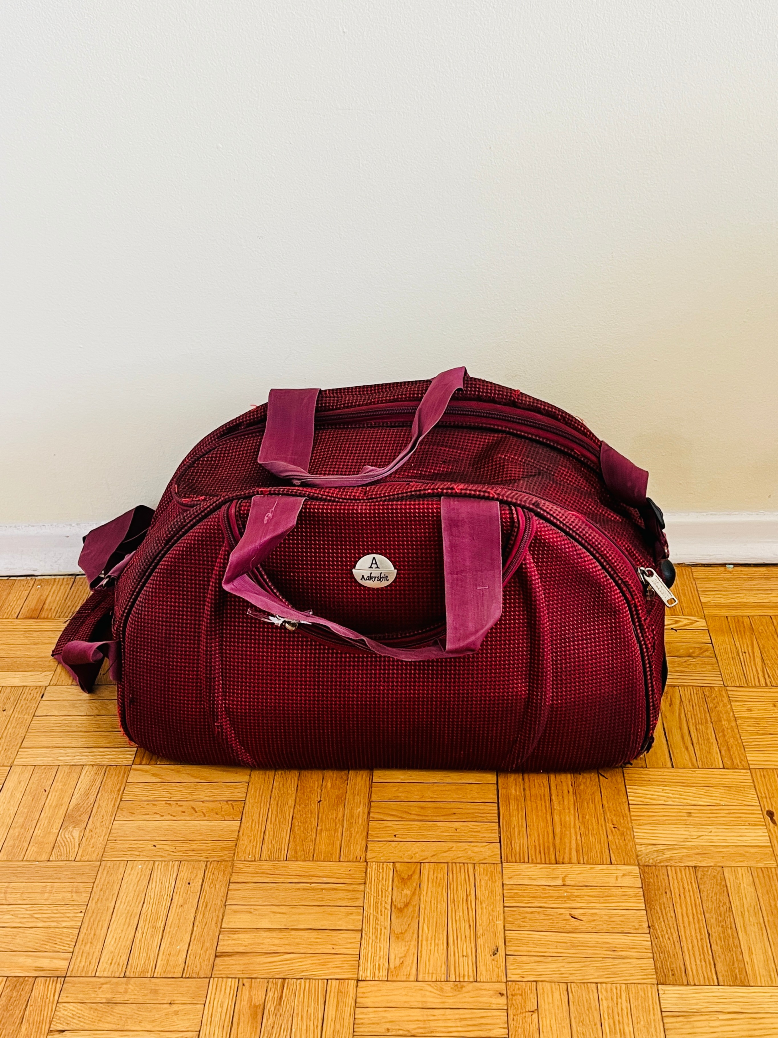 Red Luggage travel bag with 2 wheels 56cm x 30cm x 30cm