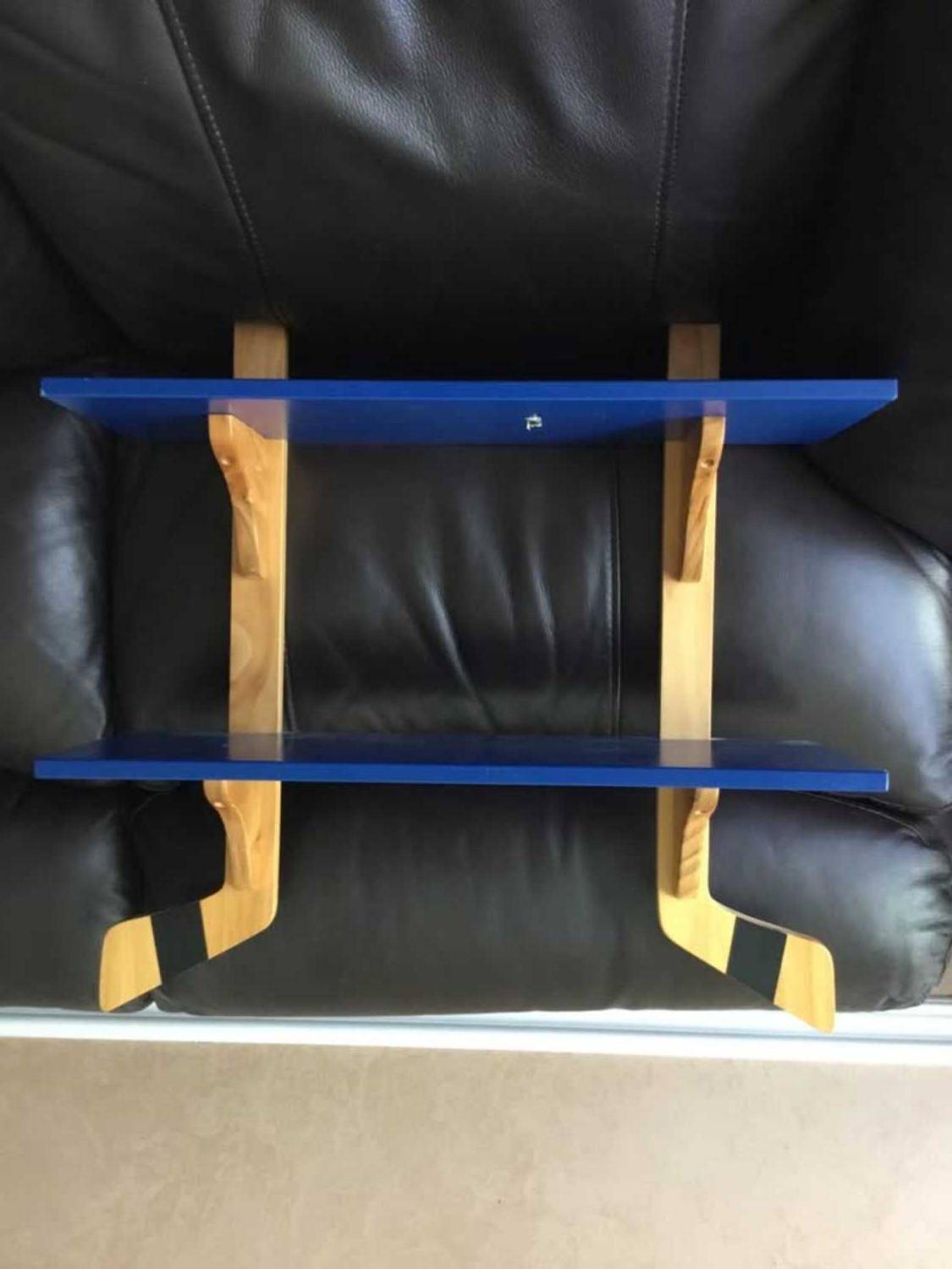 Kids hockey stick shelf