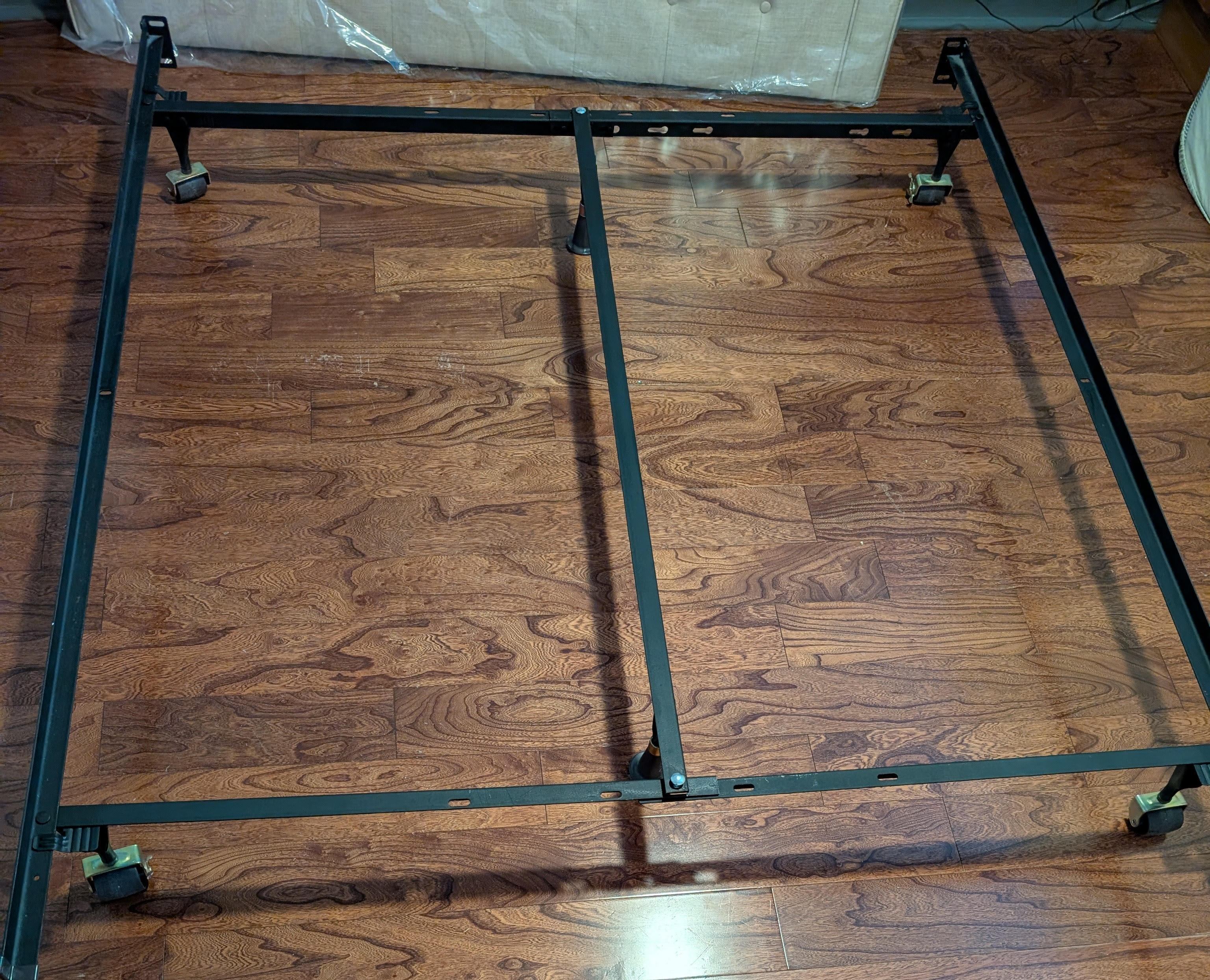 Heavy-duty metal Queen bed frame on wheels