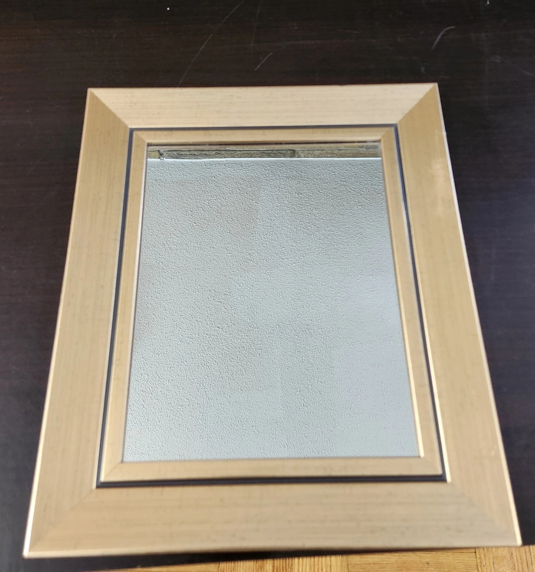 Small framed Mirror with gold trim