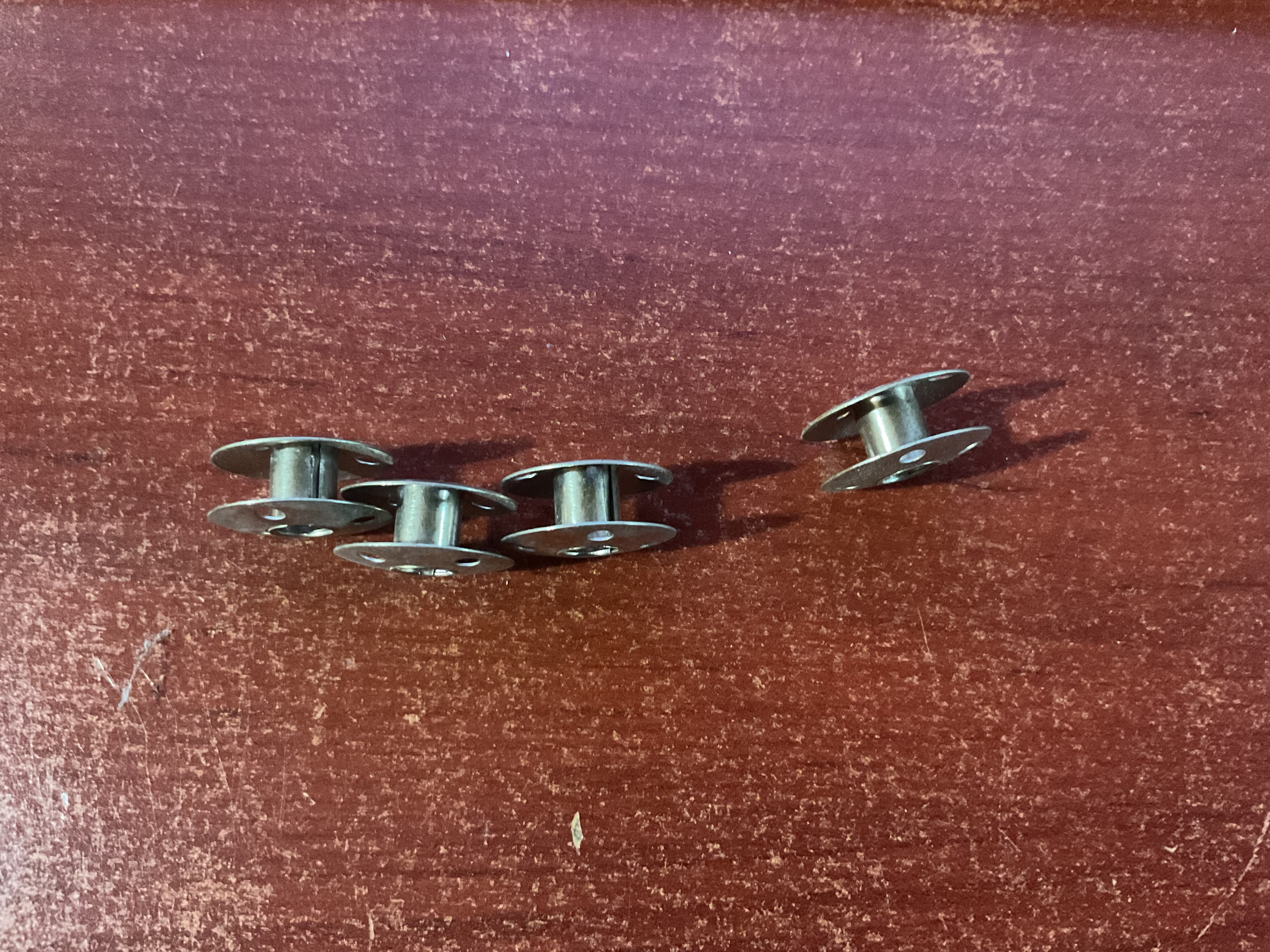 4 Metal Sewing Machine Bobbins - photo 2