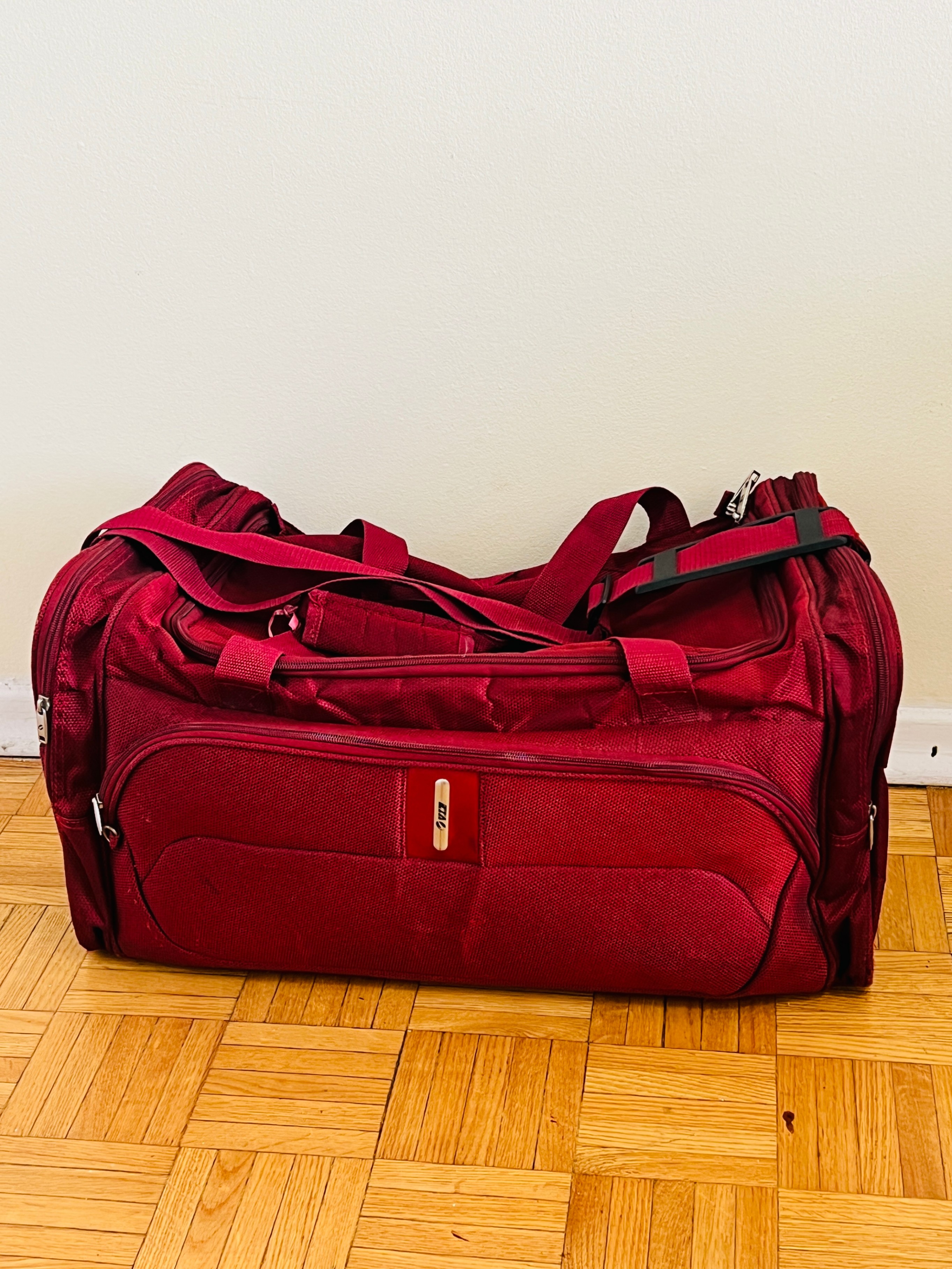 Red Luggage travel bag 56cm x 30cm x 30cm