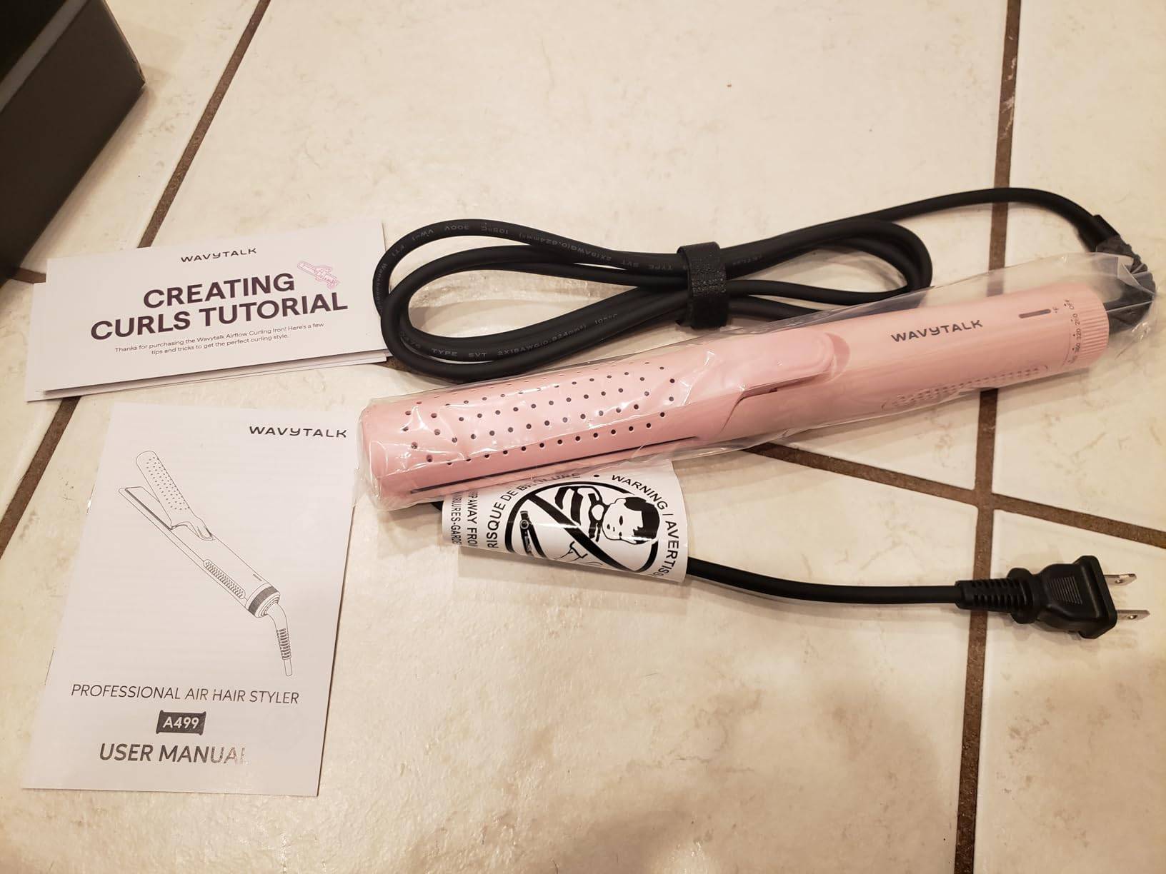 New in box flat curling iron