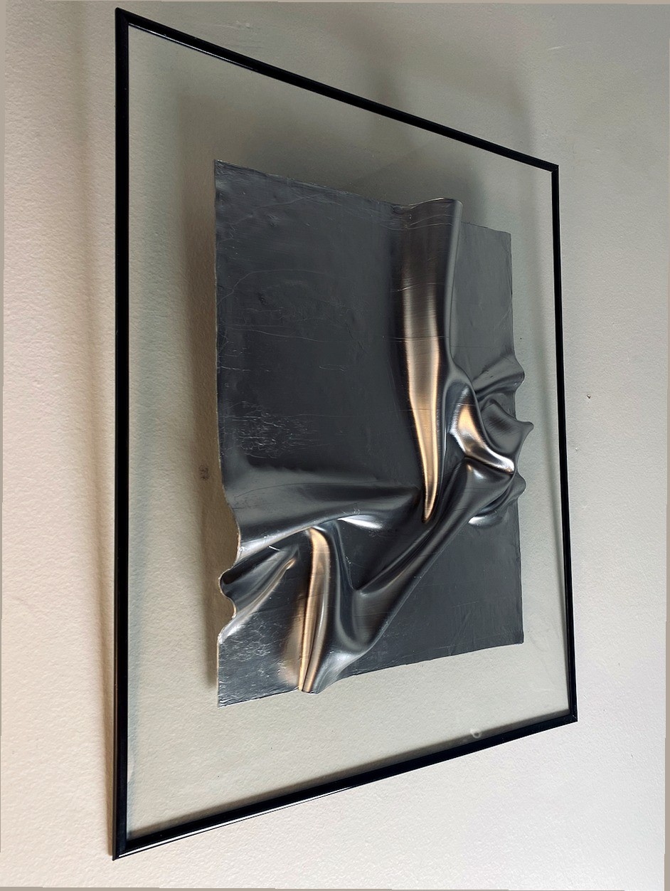 Original silver framed wall relief