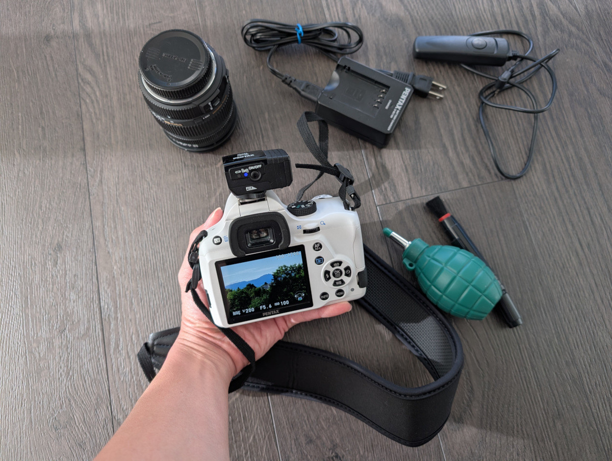 Pentax K-50 with strap, Sigma lens, kit, O-GPS1 astrotracer