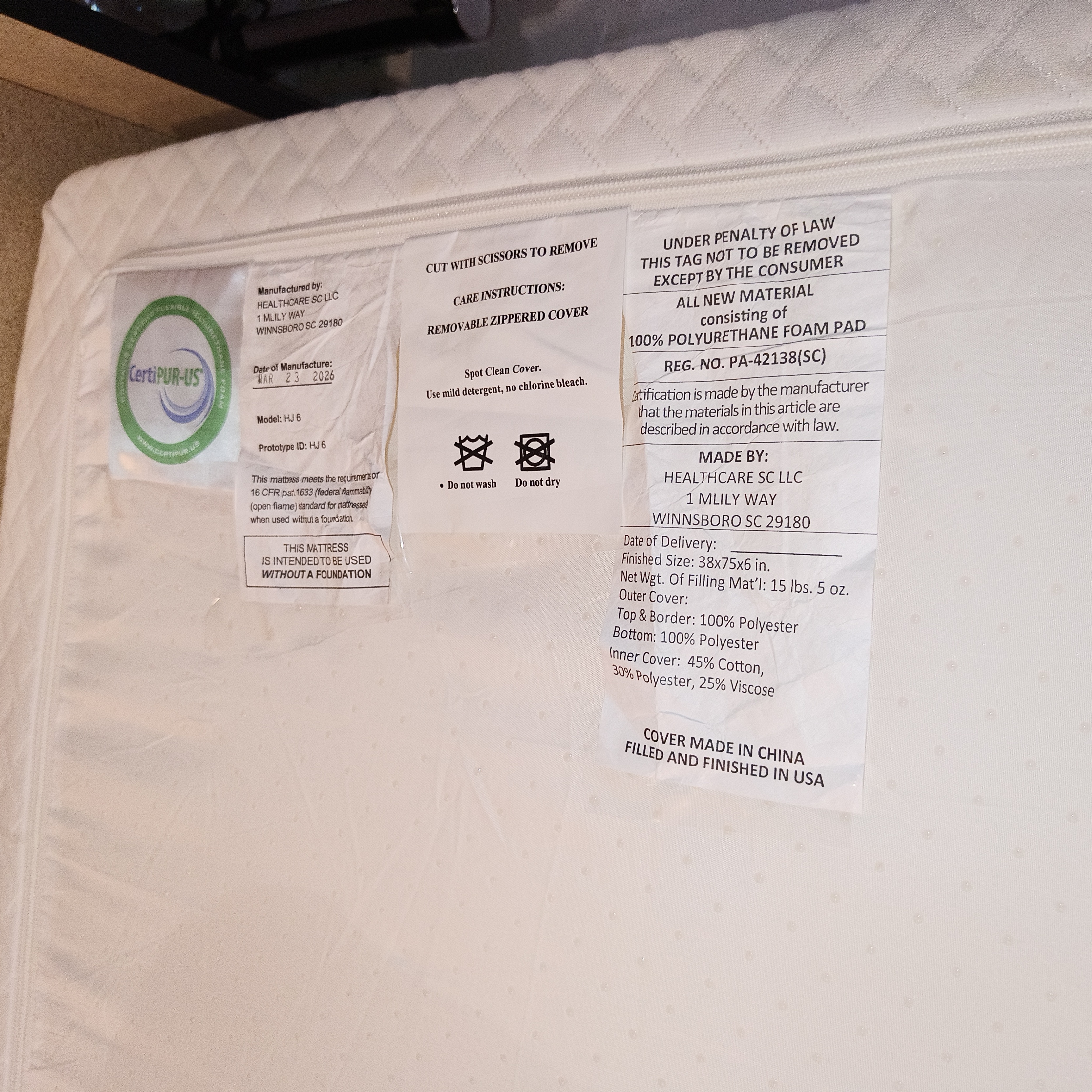 Twin bed, mattress, and extra mattress cover