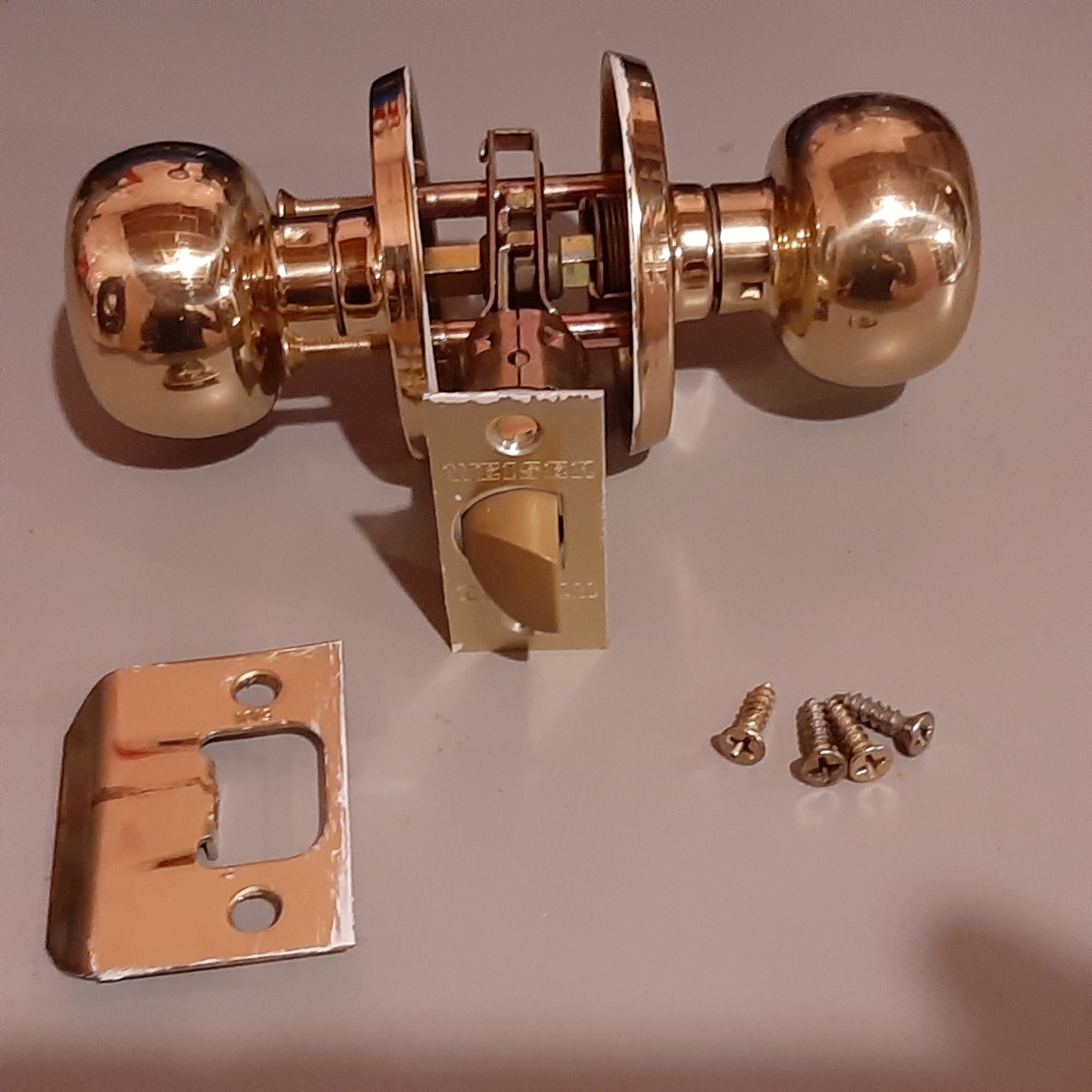 Set of 11 Weiser Gold Doorknobs
