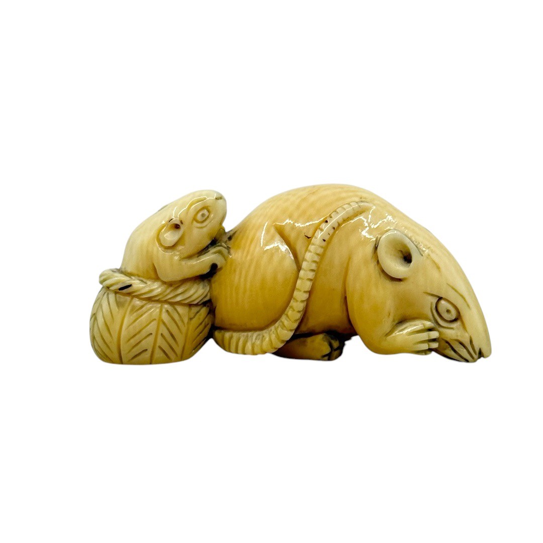 Showa period Japanese carved bone two mice in a basket netsuke