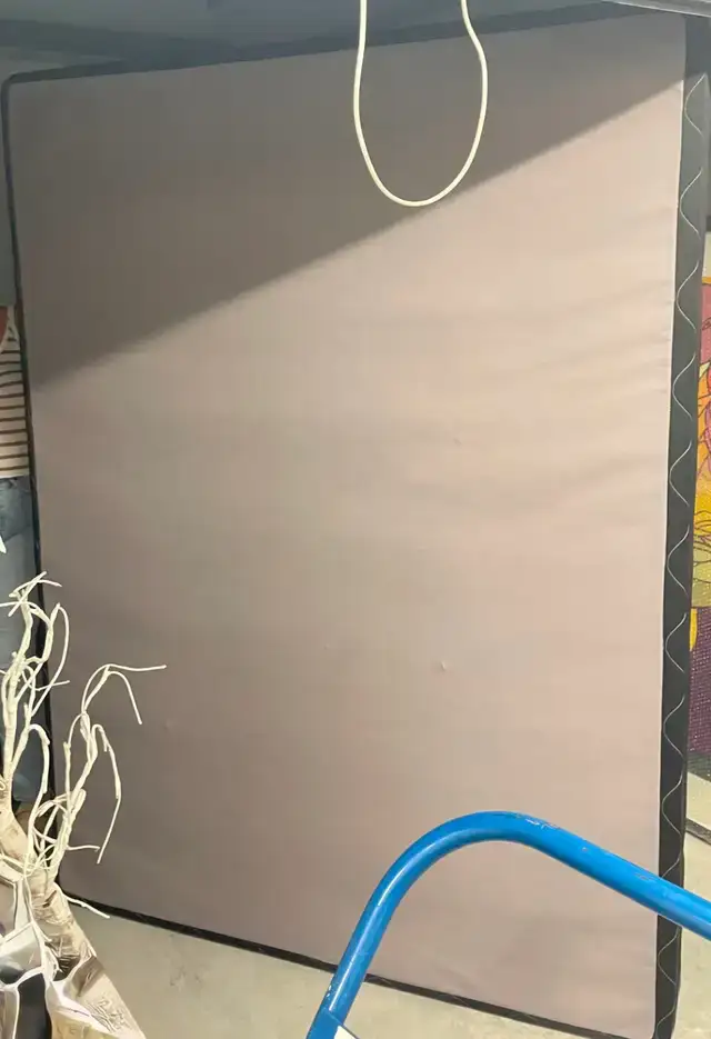 Queen-sized box spring and metal bed frame
