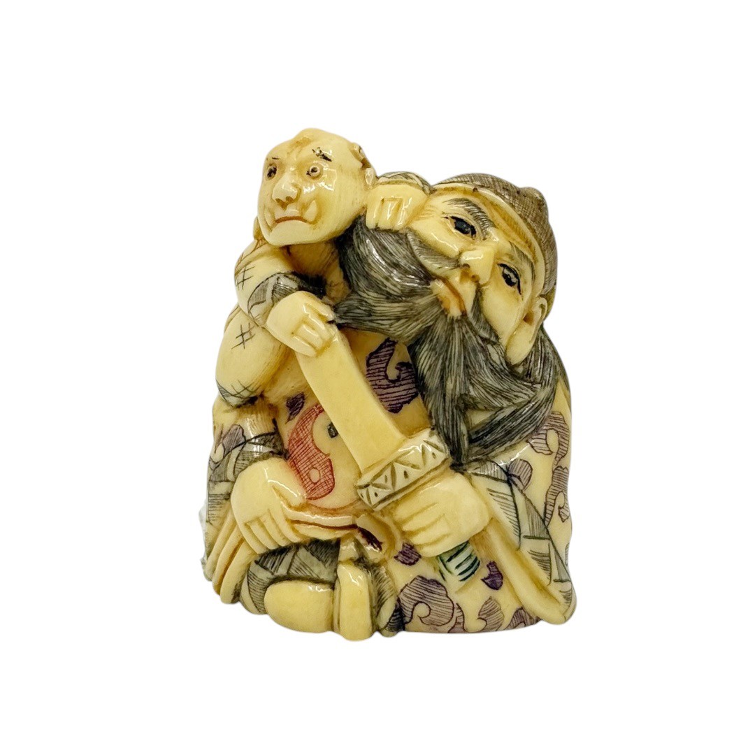 Meiji period carved bone Shoki struggling with a demon netsuke