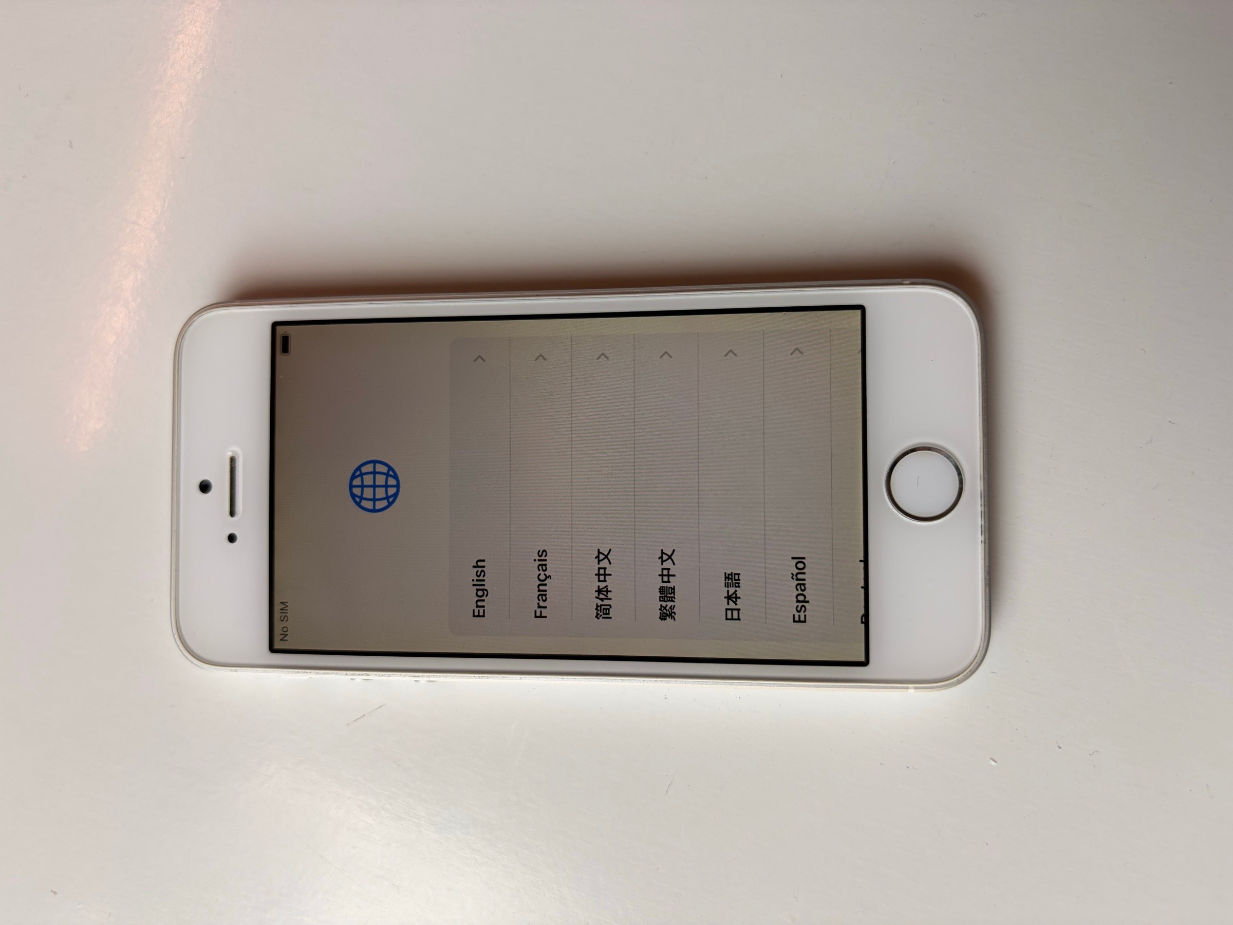 iPhone SE (1st gen), silver, 128GB, unlocked, w/ cable