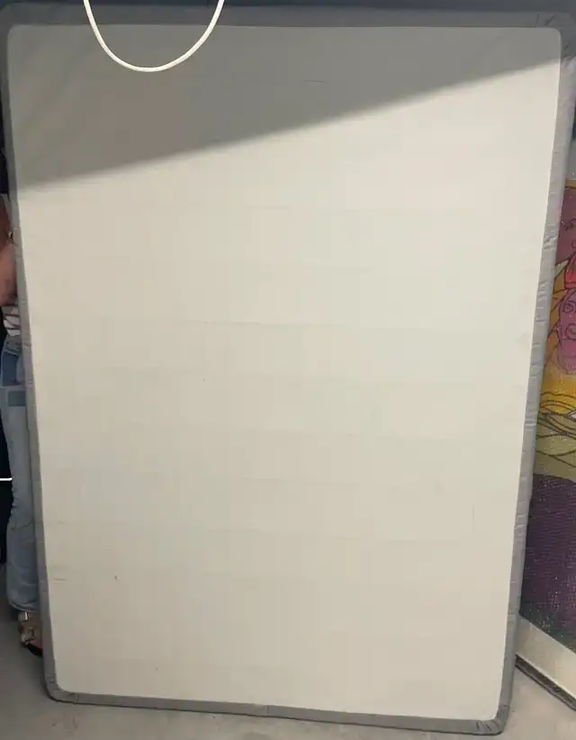 Full-sized box spring and metal bed frame