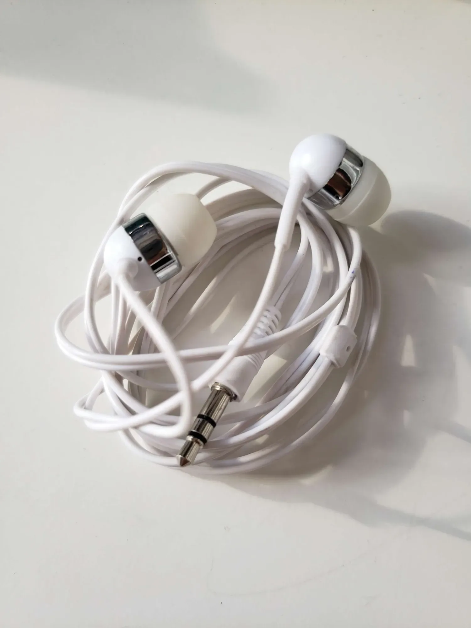 white headphones -- simple wired audio ear phones