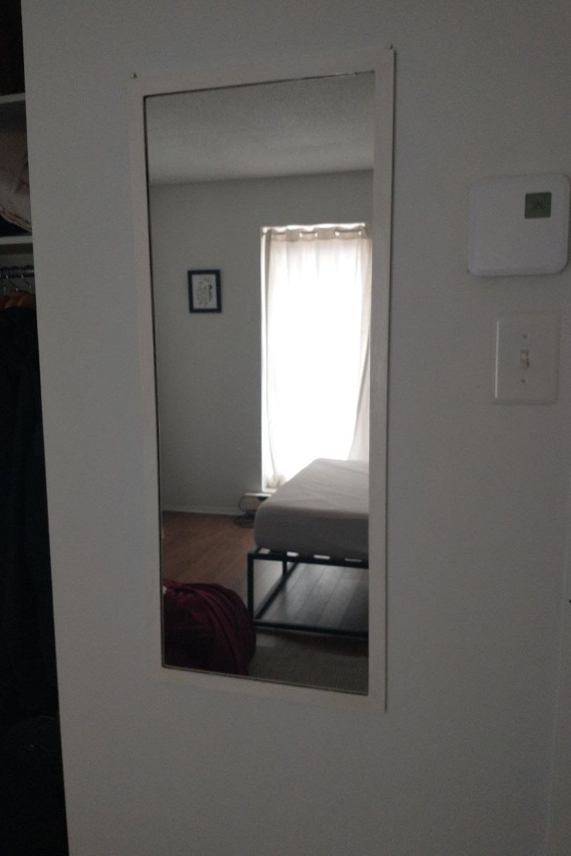 Framed wall mirror