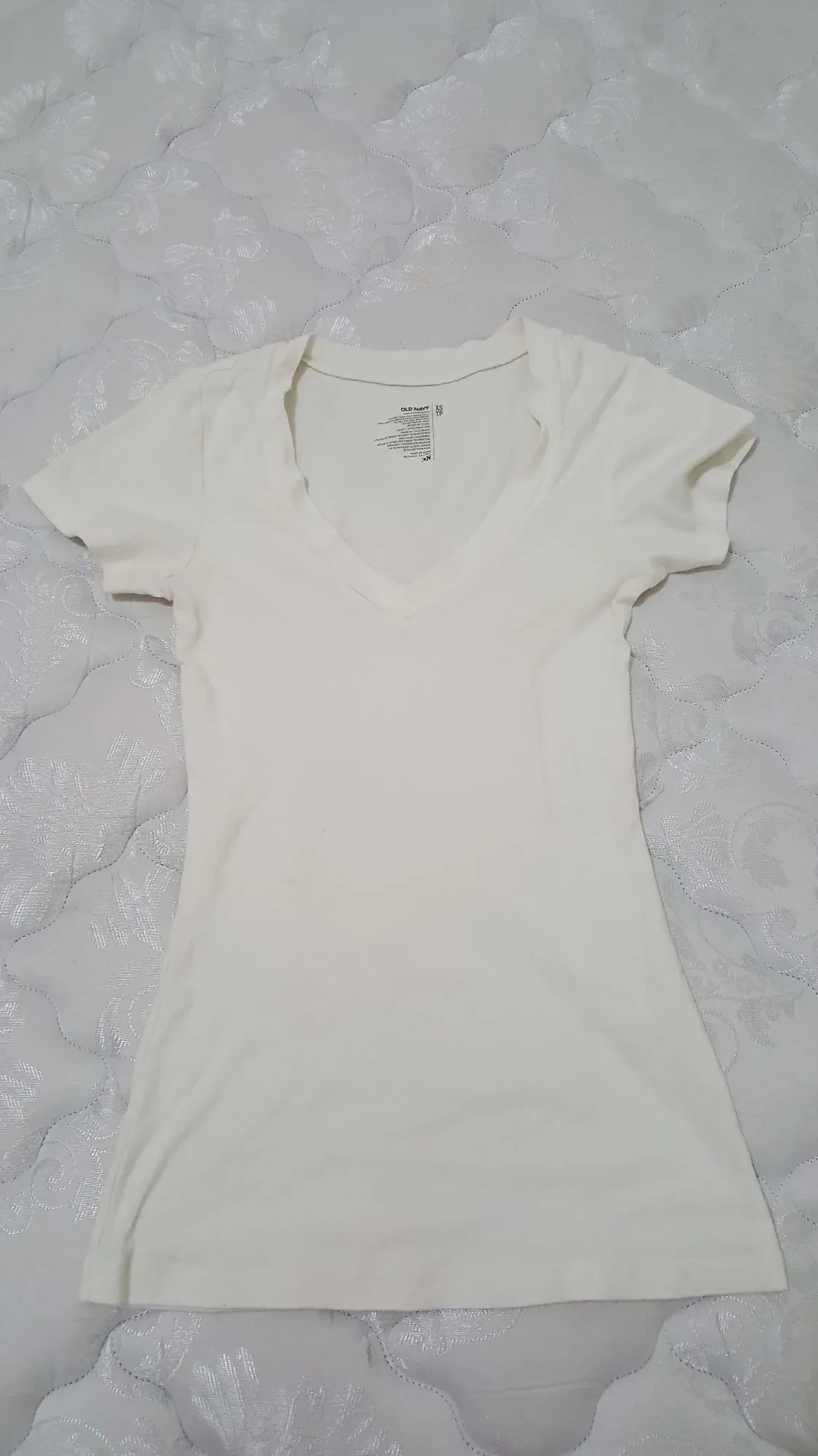 white 100% cotton v- neck t- shirt. soft & flattering. worn o...