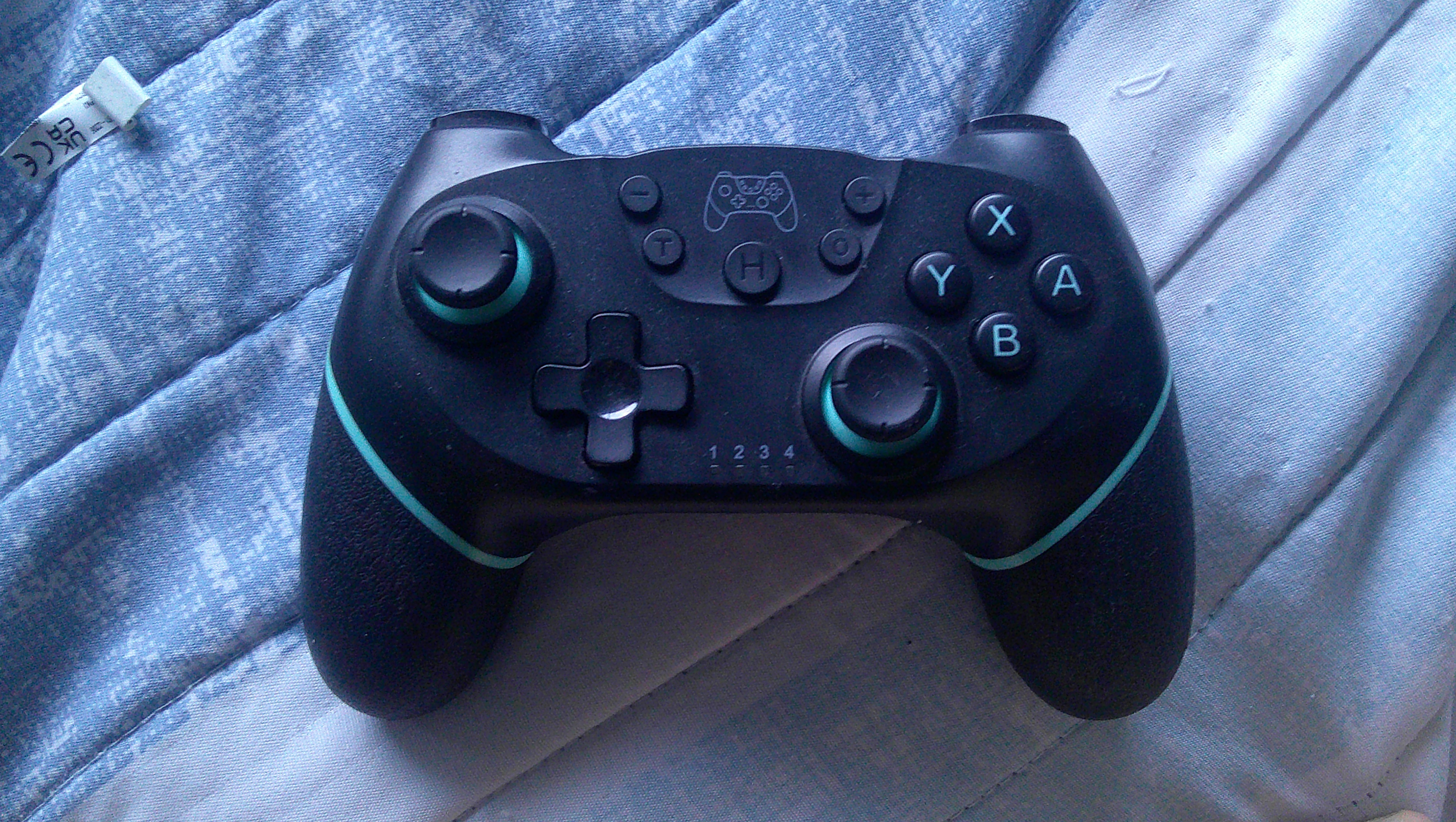 Black and blue nintendo switch pro controller