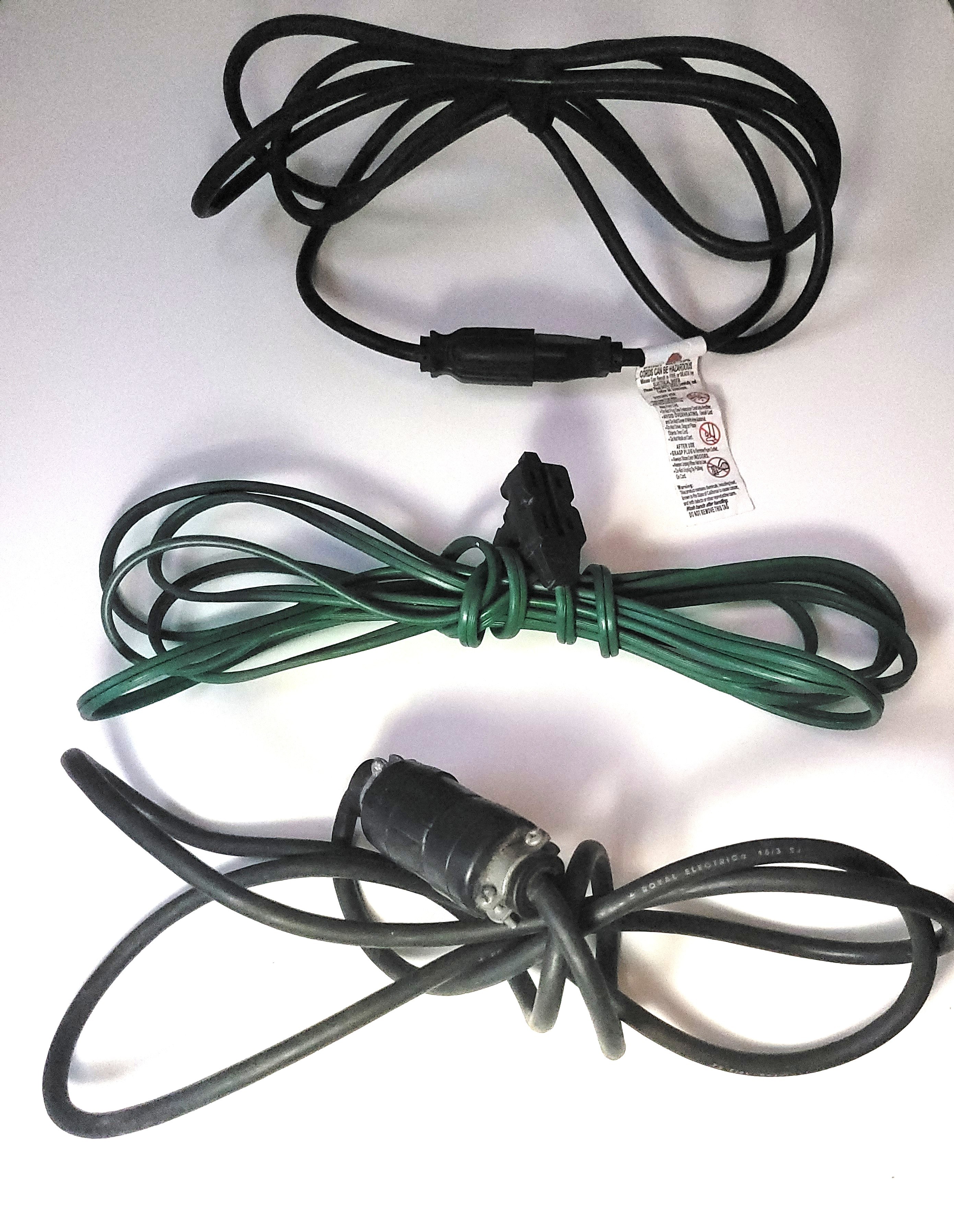 Bundle of 3 functional extension cords of various lengths.