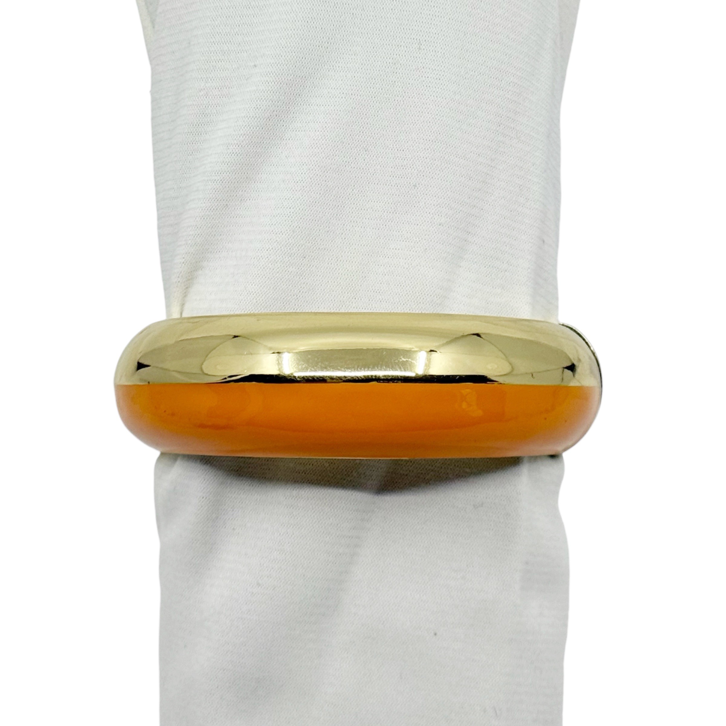 Gold tone enamel hinged bangle bracelet