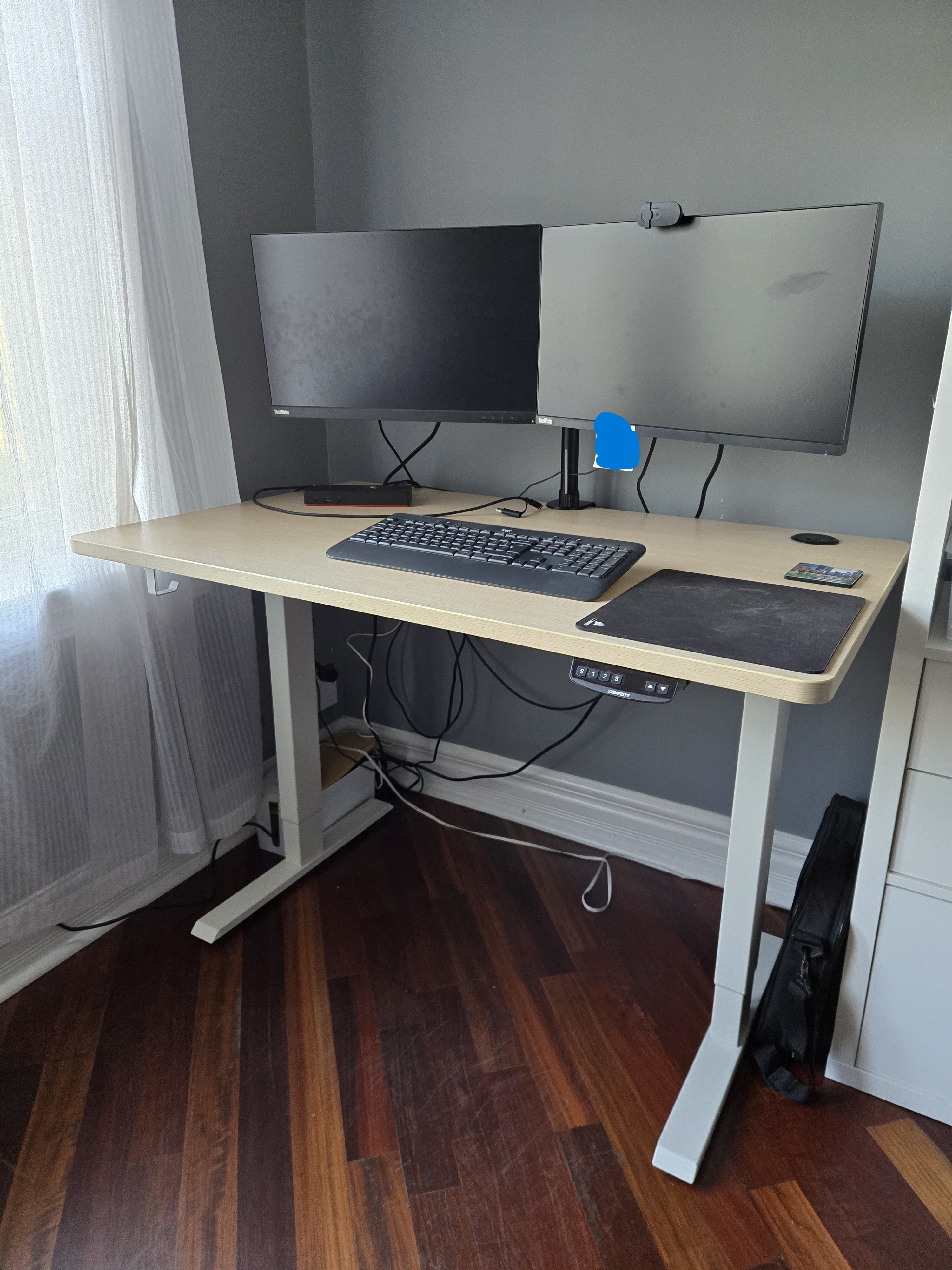48"×30" electric standing desk, white frame, light wood top