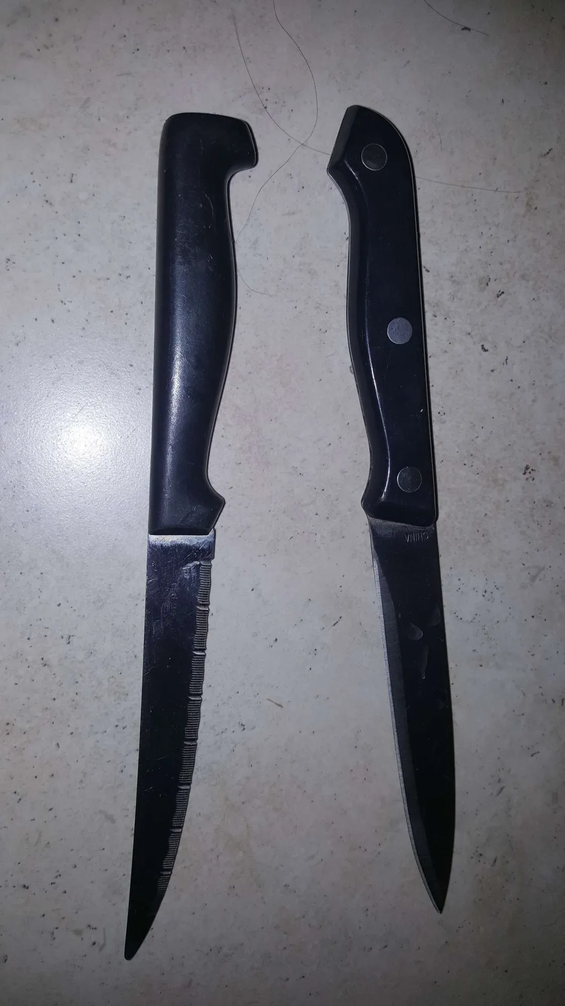 2 knives -- stainless steel -- 1 serrated, 1 not
