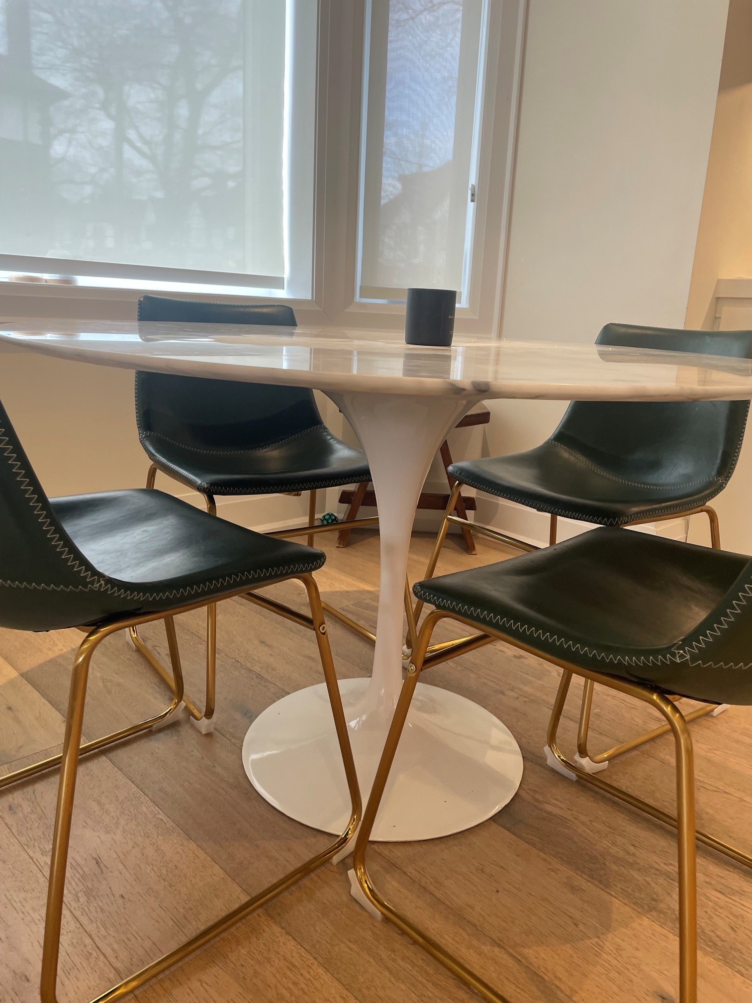 4 dark green leather dining chairs from West Elm