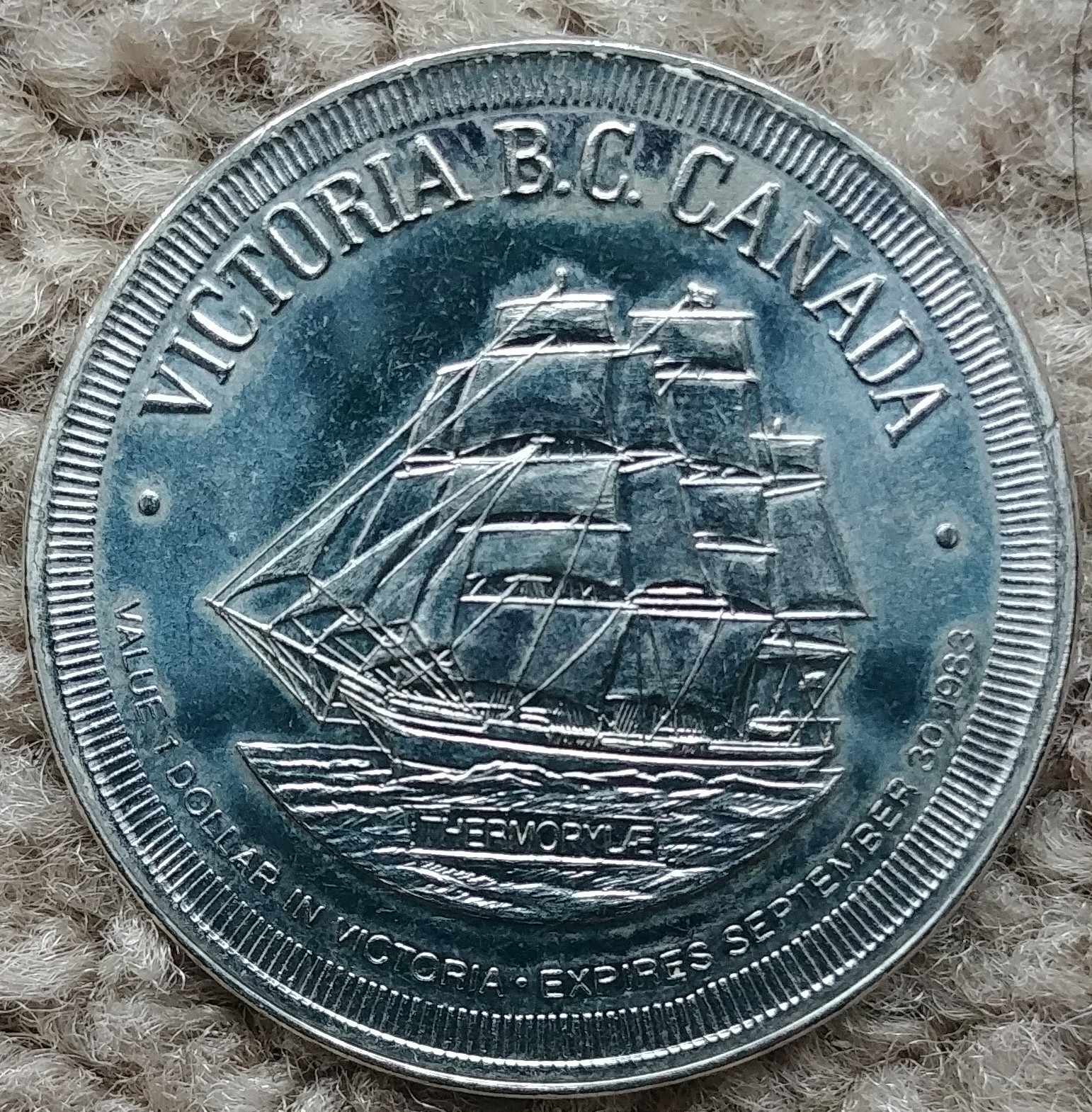 One 1983 Victoria B.C. Canada City of Gardens Trade Dollar