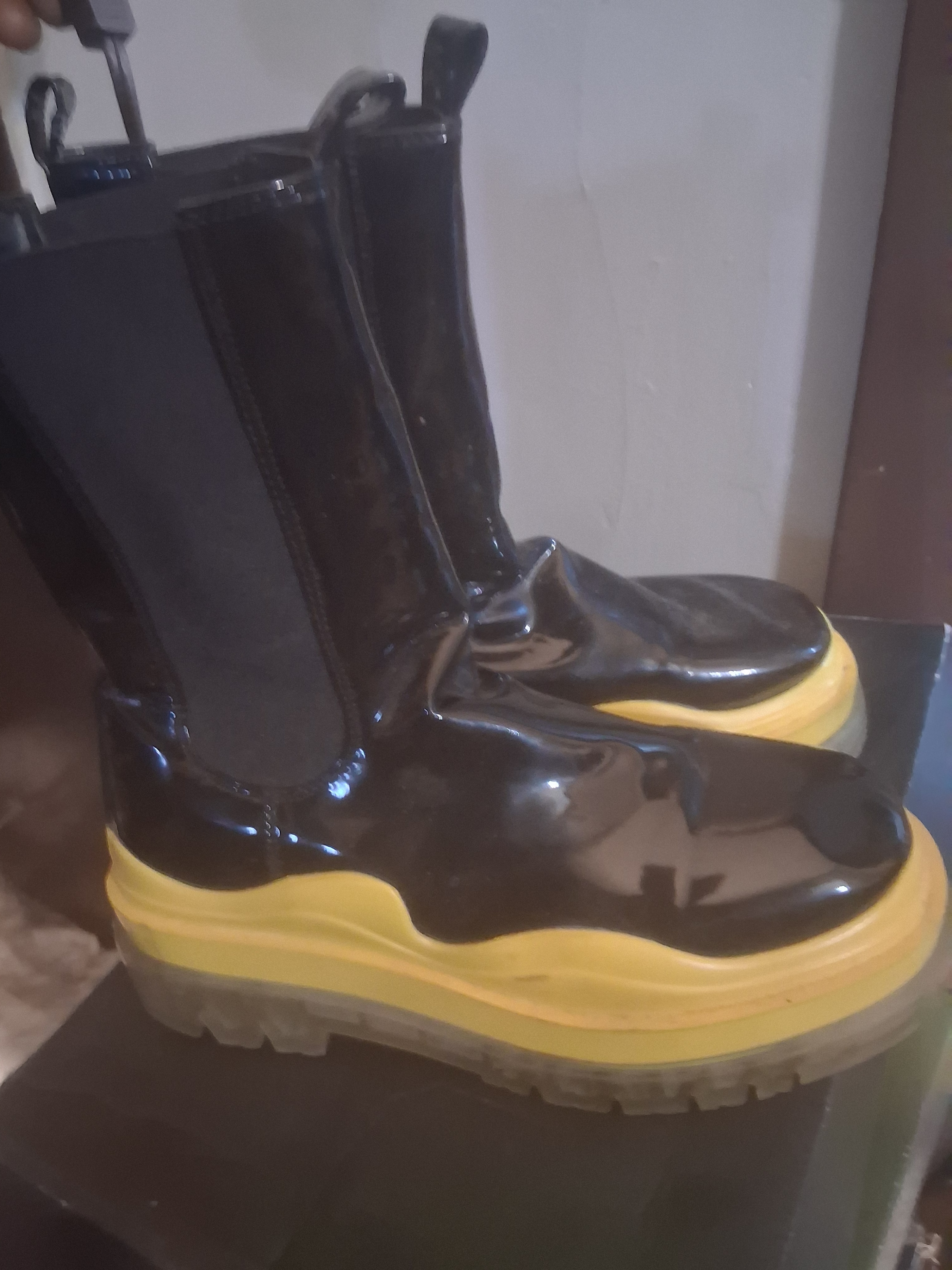 Black and yellow platform boots