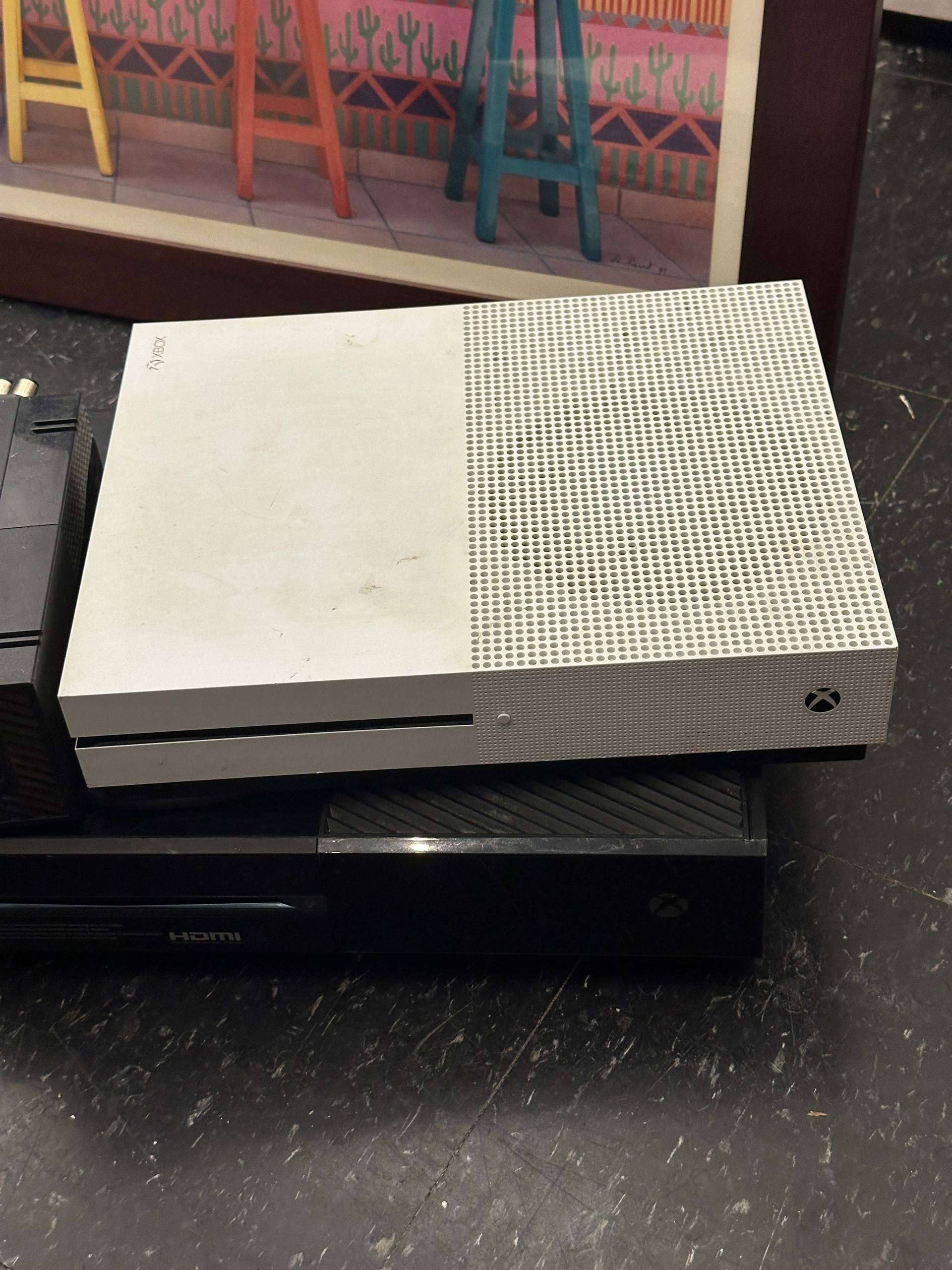 two XBOX consoles. As is for parts.