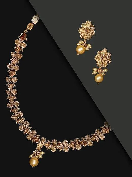 Gold coloured necklace and earring set with pearls