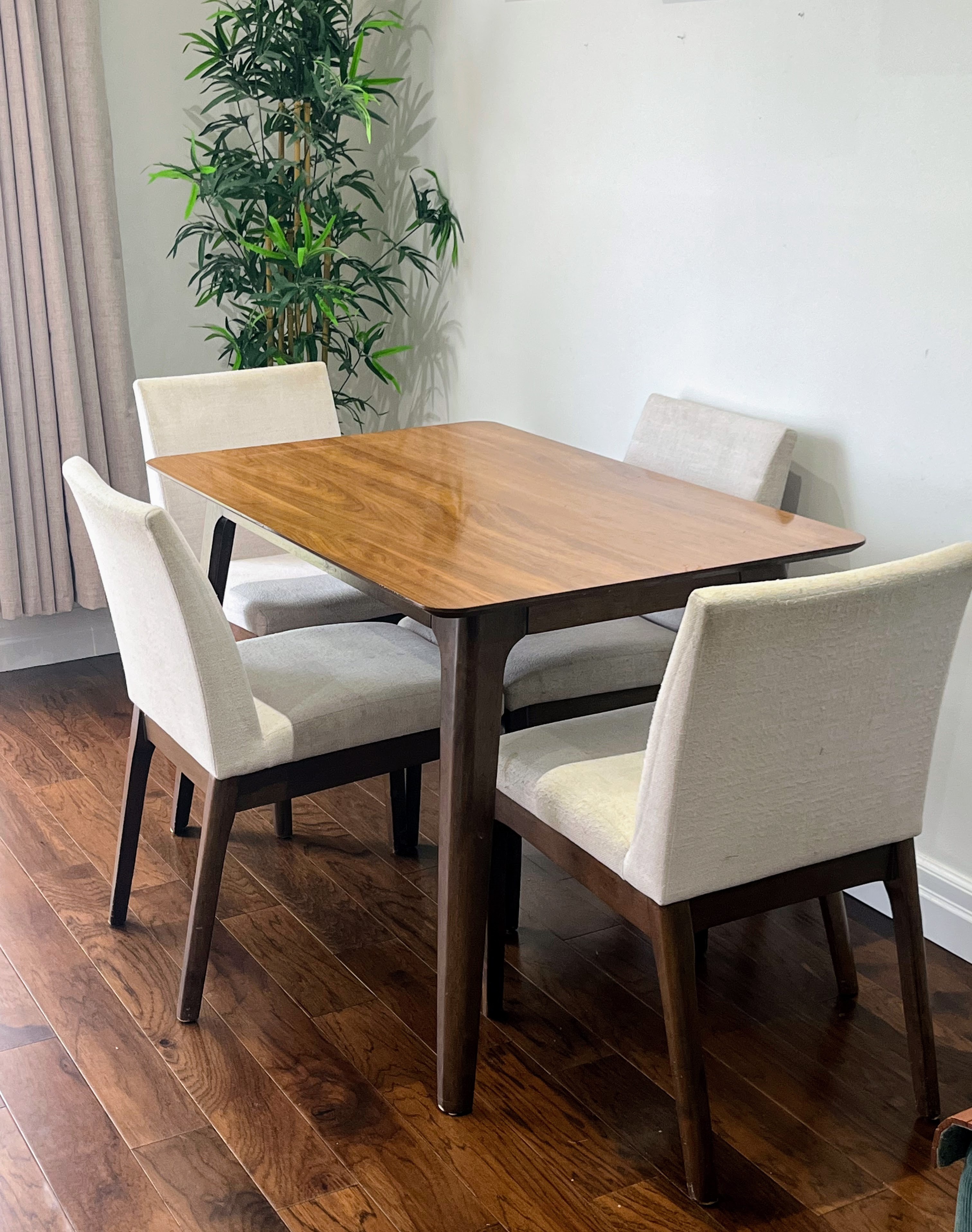Hardwood Dining table 4-seater with 3 pairs of extra covers.