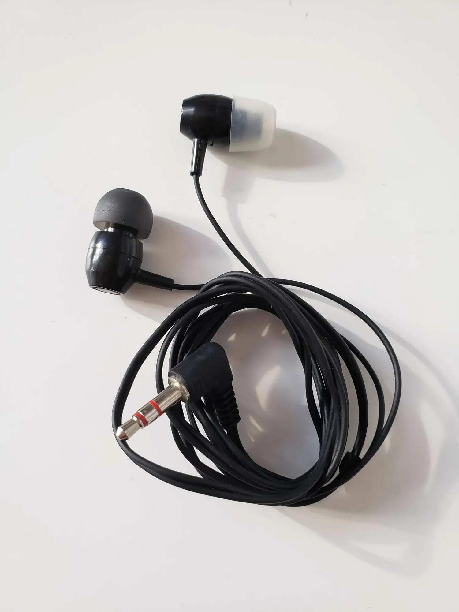 headphones -- simple wired audio mismatched white and black c...