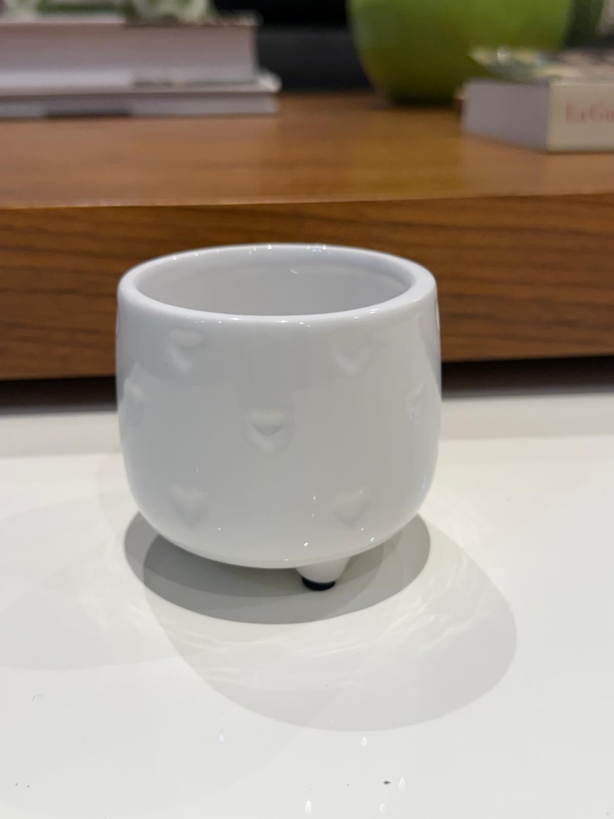 White ceramic pot with hearts