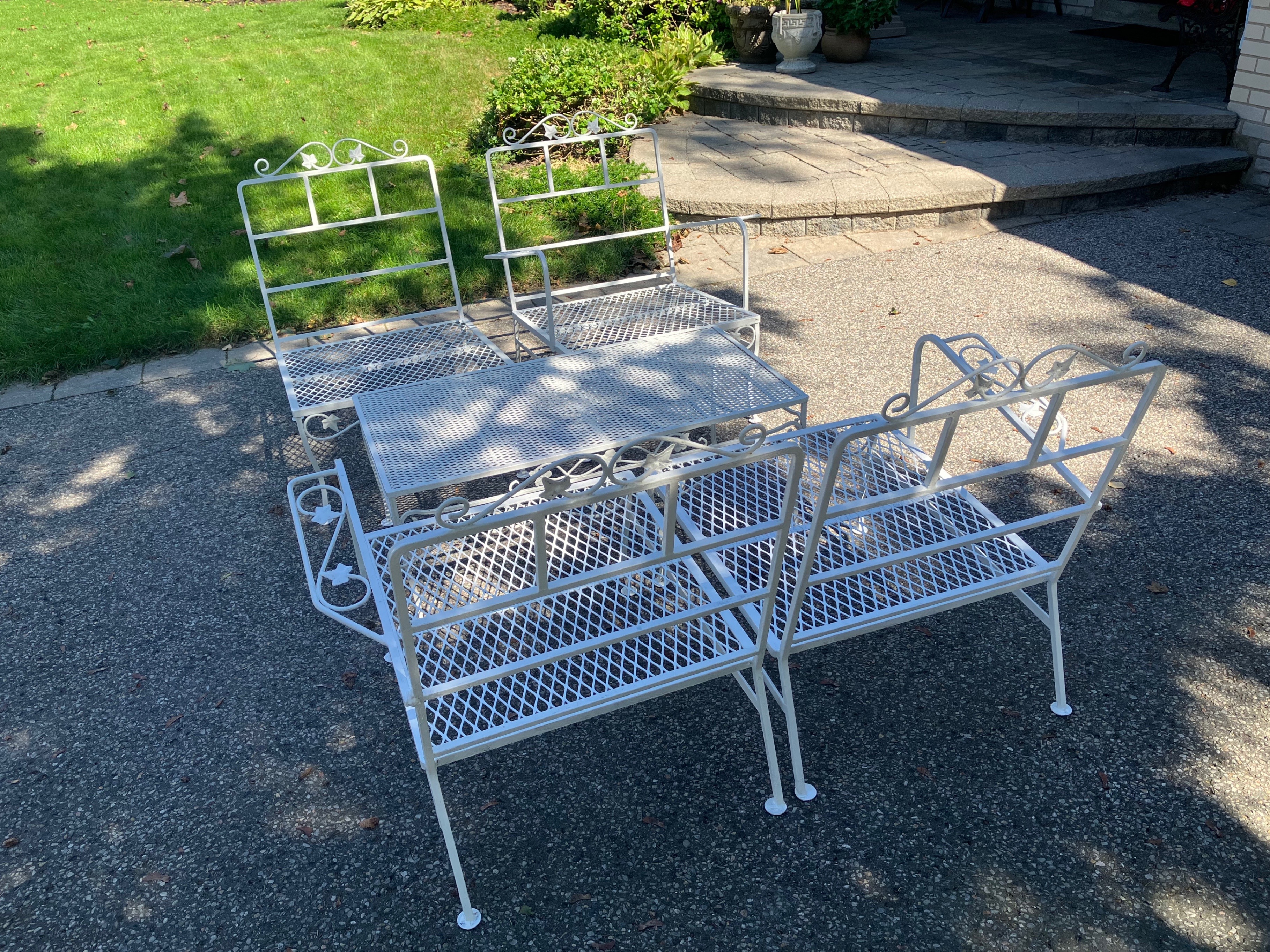 Vintage wrought-iron outdoor chairs and table