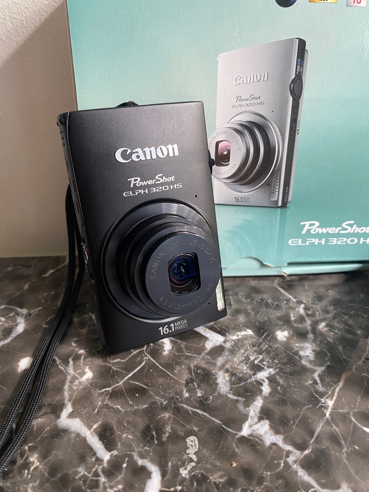 Like New Canon PowerShot ELPH 320 HS Digital Camera In Box
