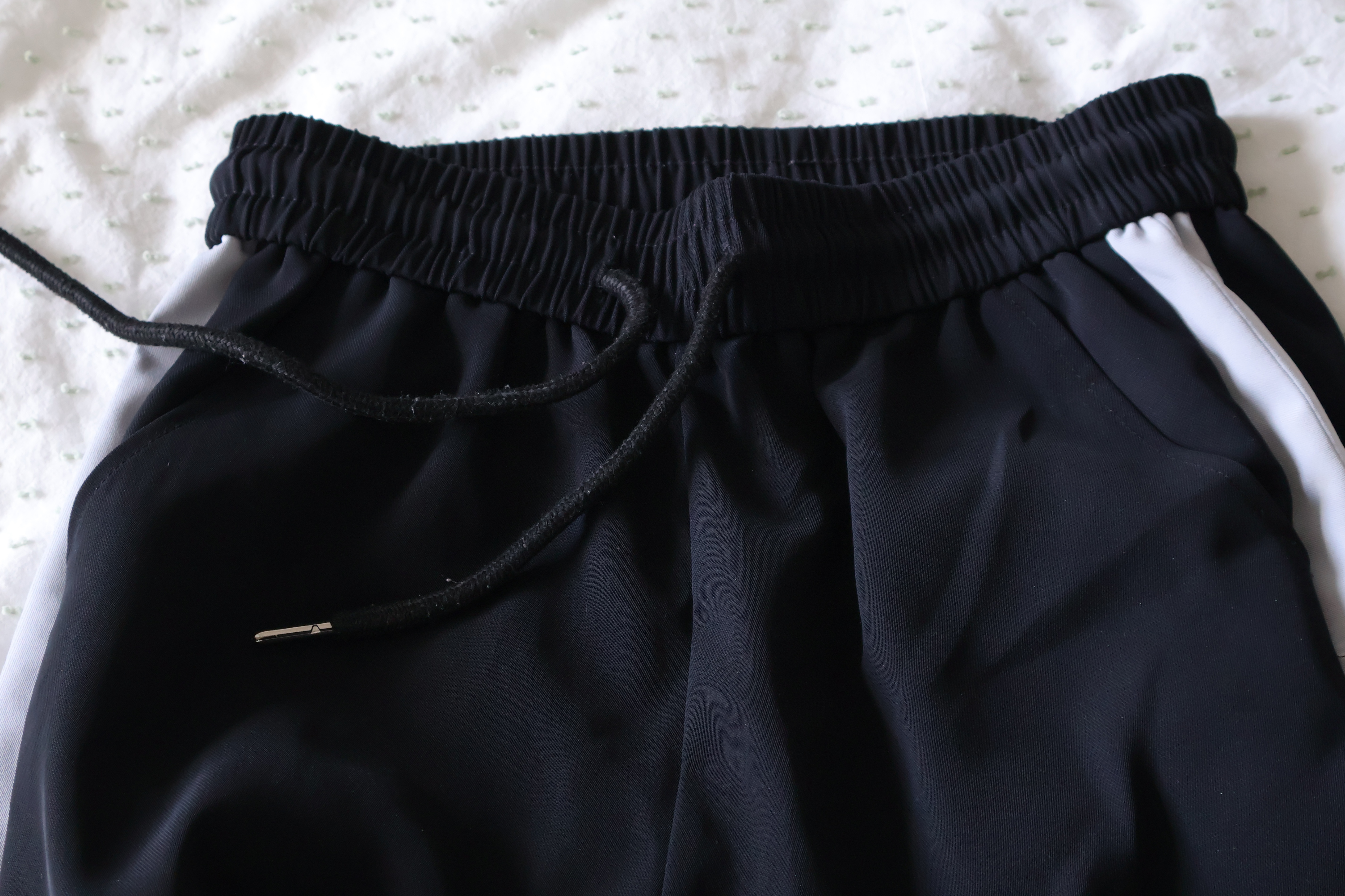 Black striped track pants