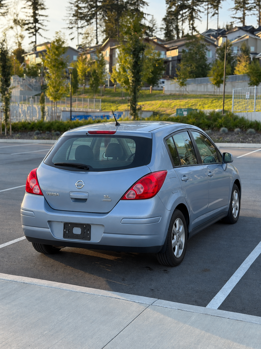 2012 Nissan Versa Hatchback with barely used Snow Tires - photo 2