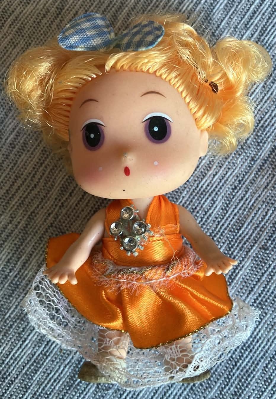 Small Doll wearing Orange Dress - 3 Inches