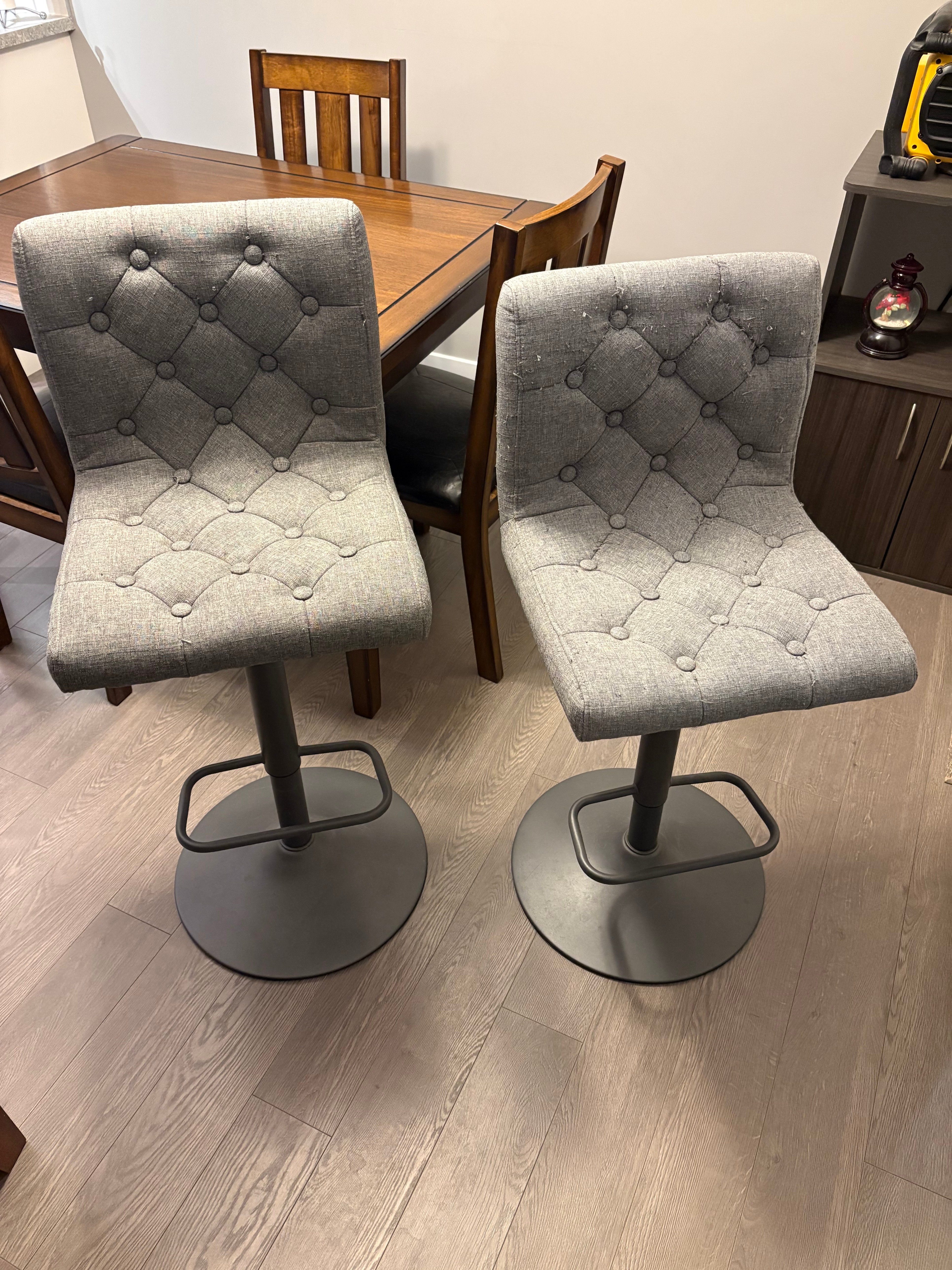 Two Grey Adjustable Tufted Bar Stools
