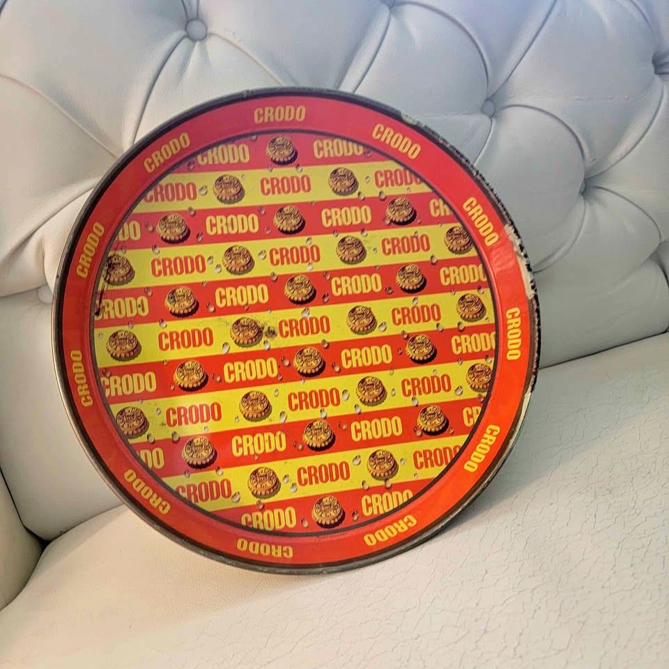 vintage Crodo metal advertising tray featuring a repeating
