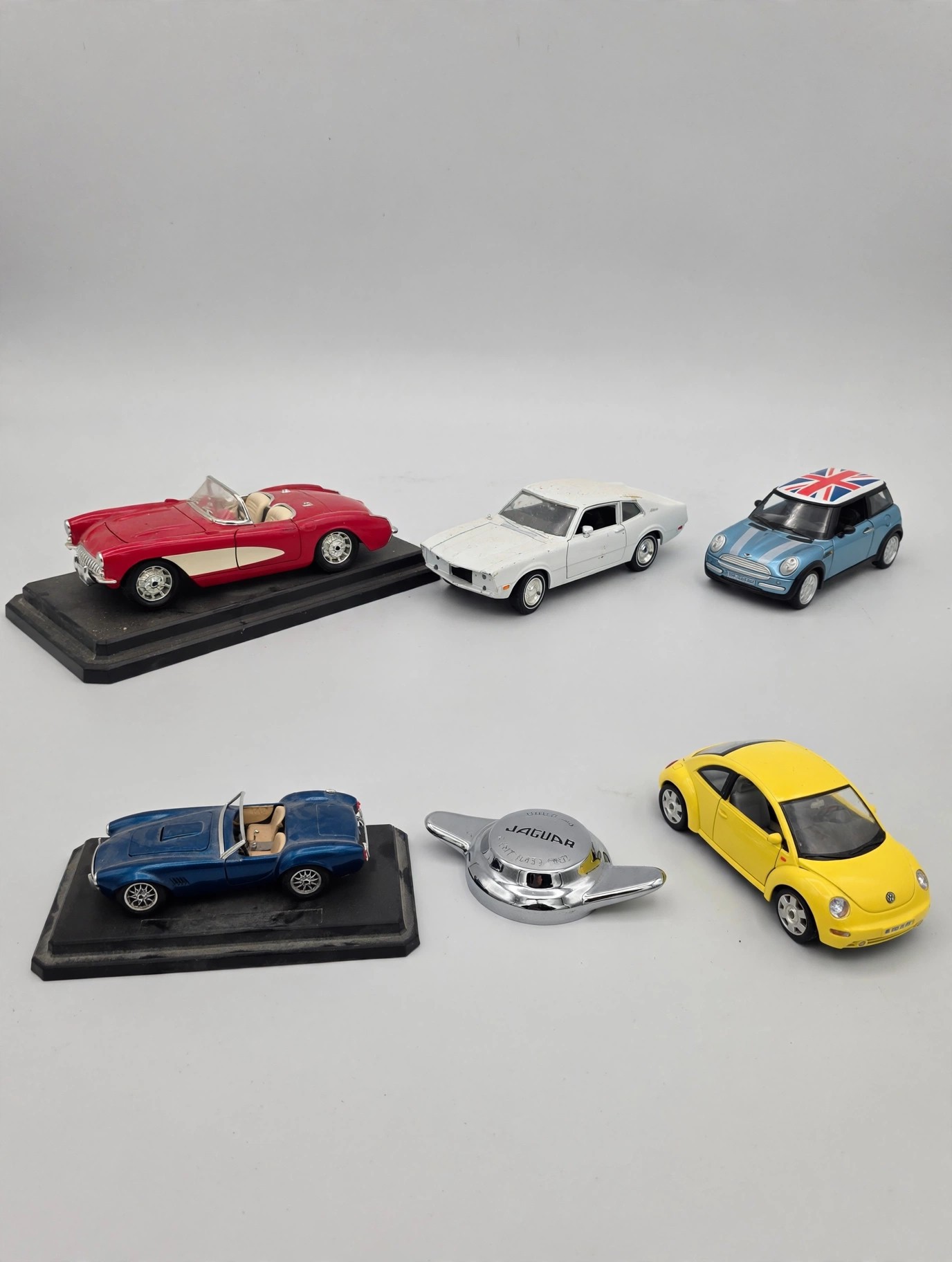 12 Piece 1:18 Scale Diecast Lot: 10 Cars, Plane, Jaguar Ornament