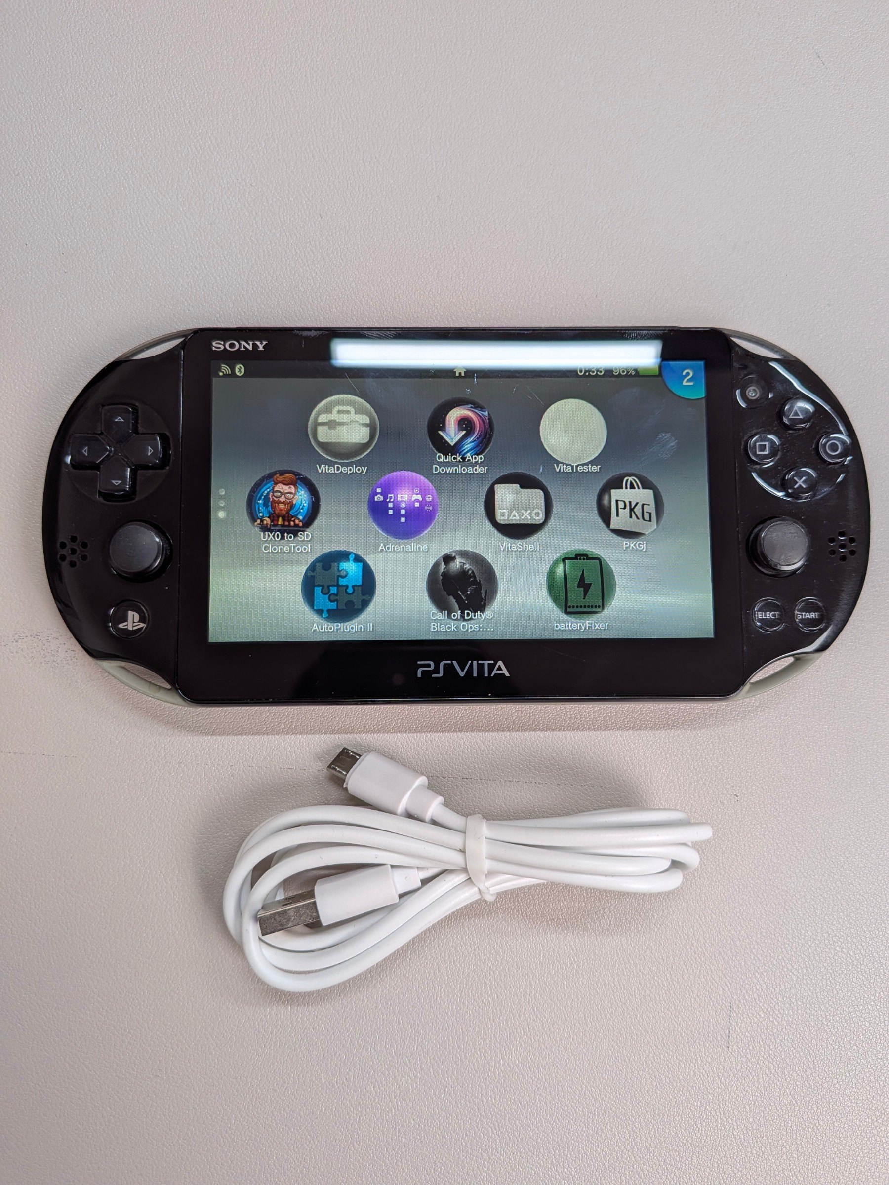 PS Vita 2000 Army Green, Charger + 64GB Card - photo 5