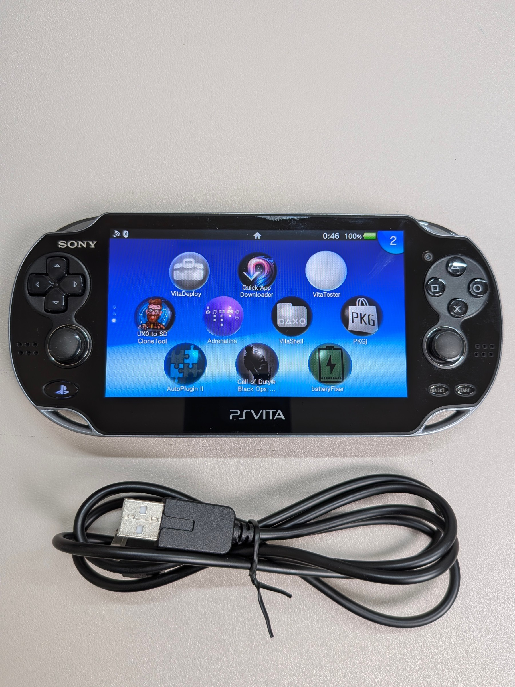 PS Vita 1000 Black Like-New, Charger + 64GB Card - photo 5