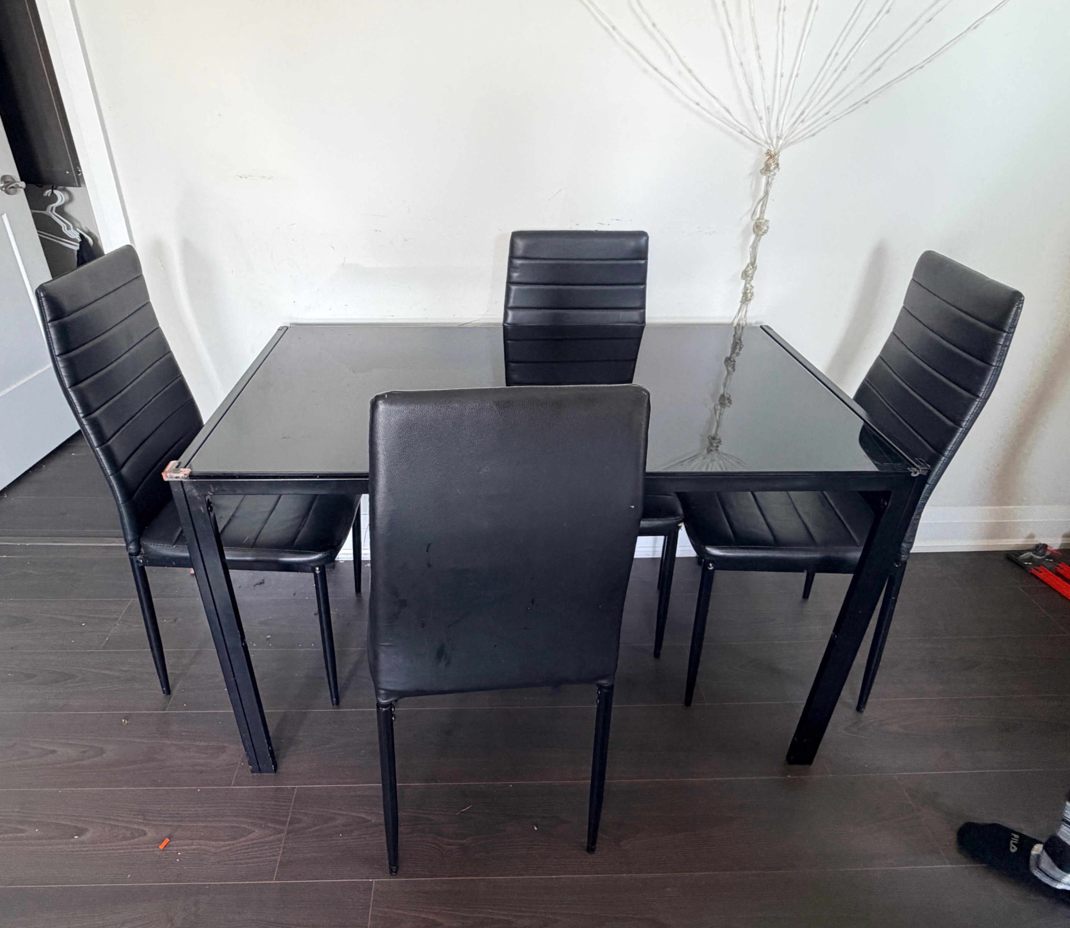 Moving Out Black Glass Dining Table with 4 Chairs