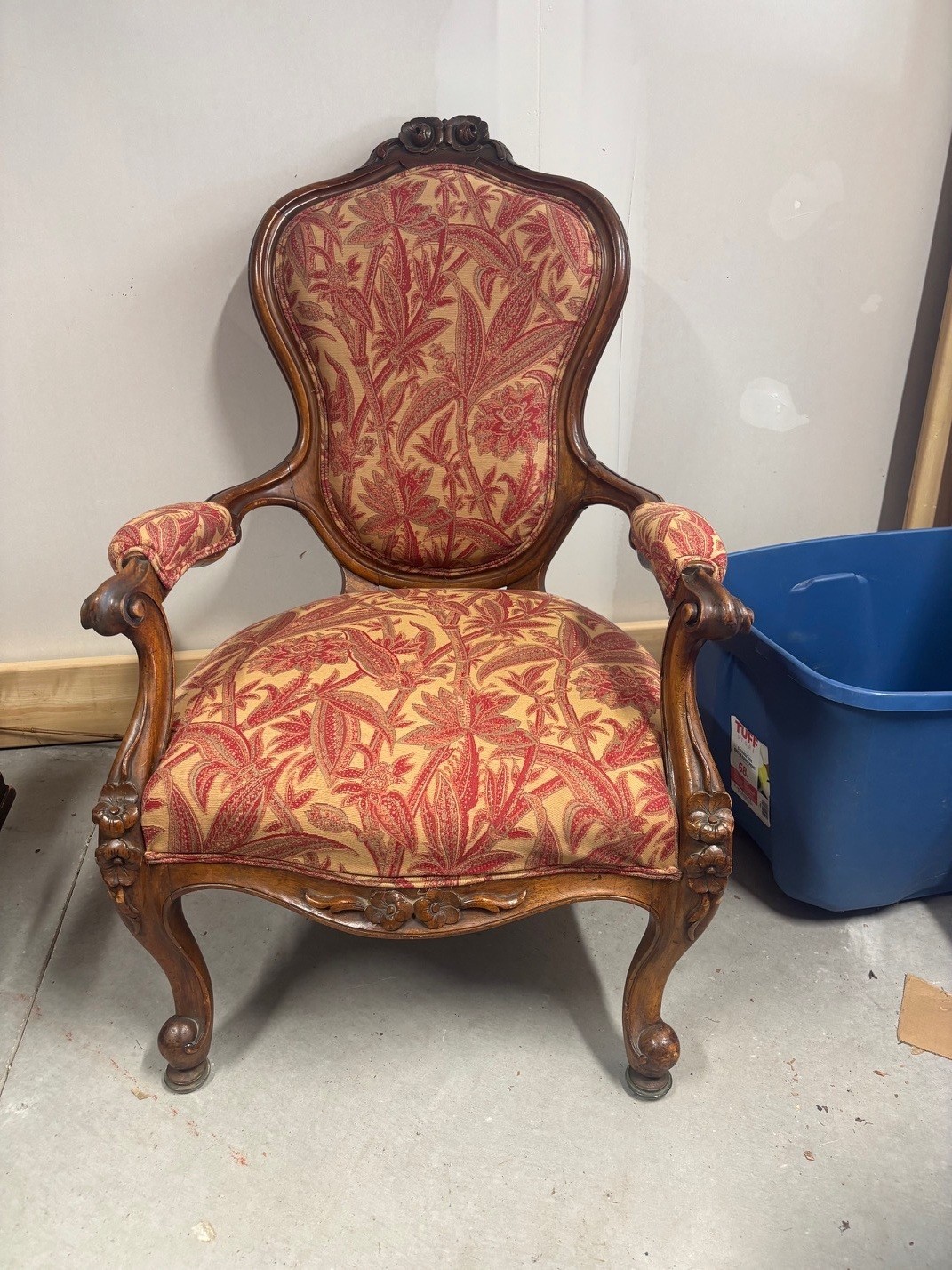 A carved mahogany Victorian armchair