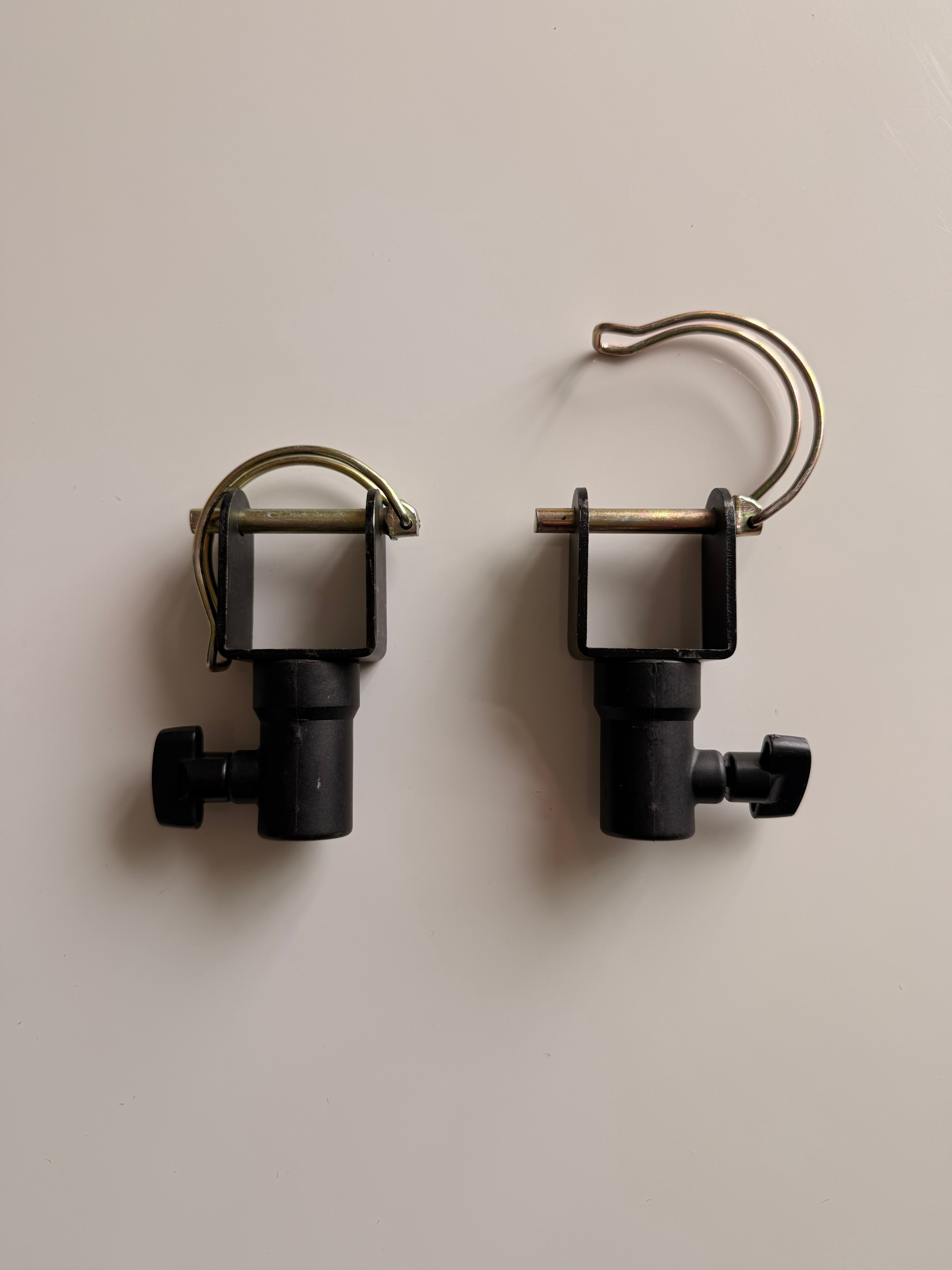 Black telescoping pole with quick release mounting brackets