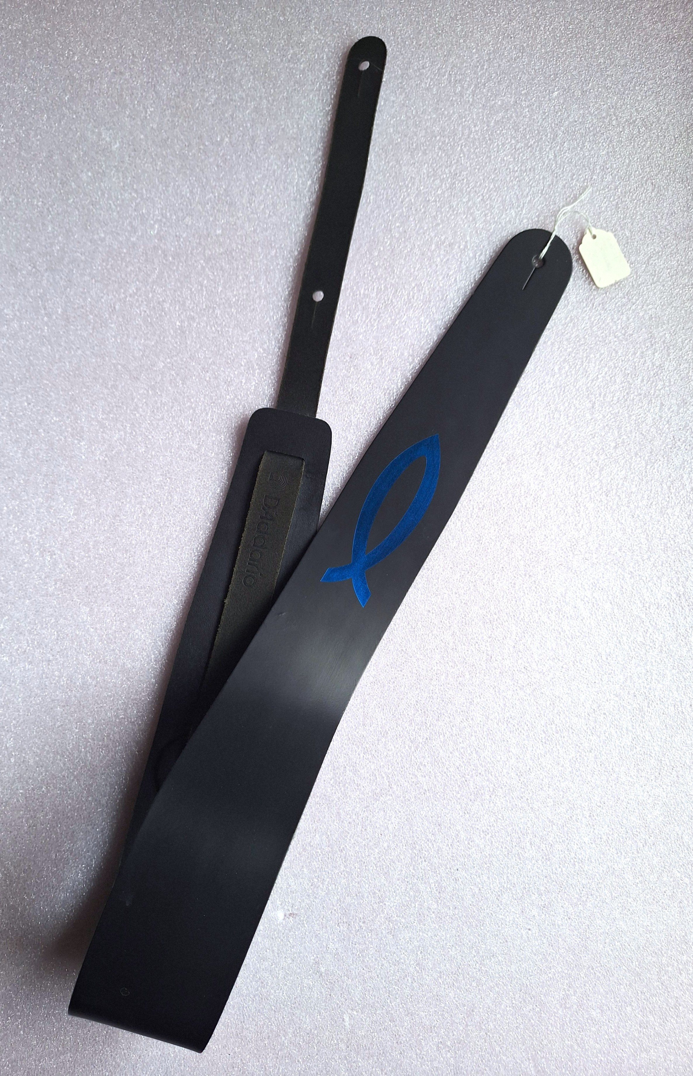 D'Addario black guitar strap with fish emblem