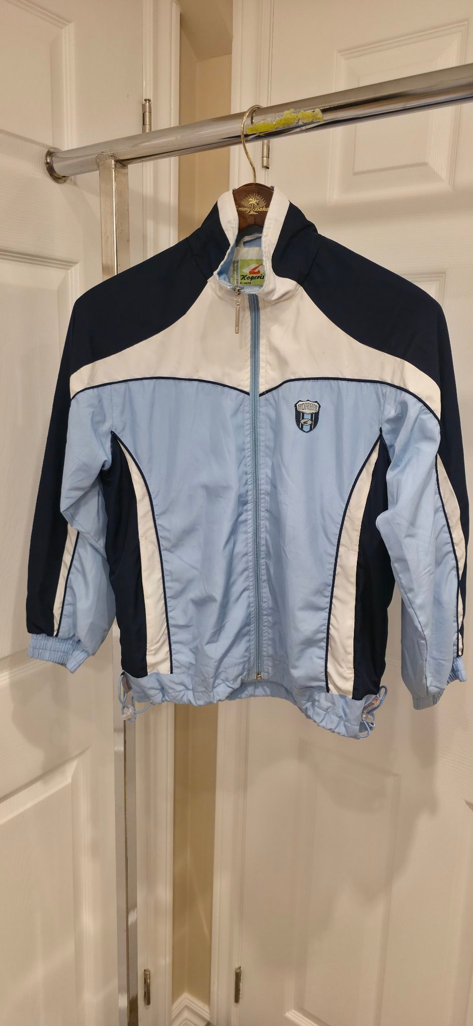 Kids Hoperise windbreaker size 10, light blue/navy/white