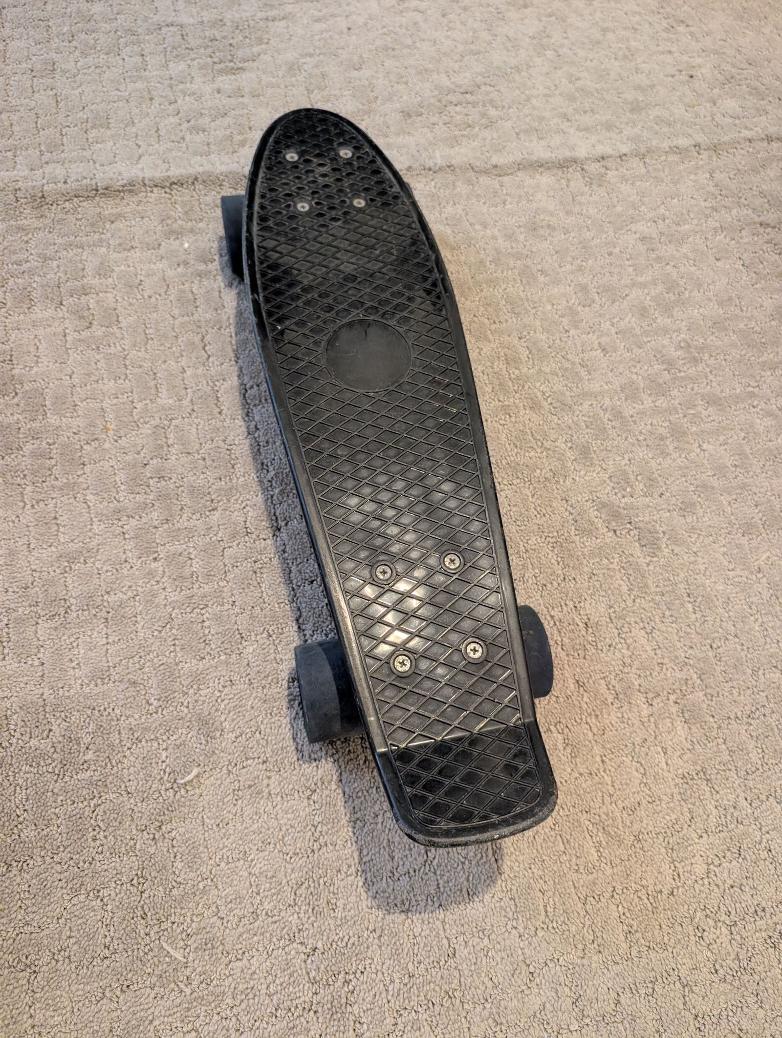 Penny board with upgraded low-friction wheels