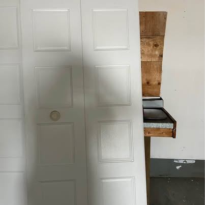 Two White 4-Panel Bi-fold Closet Doors